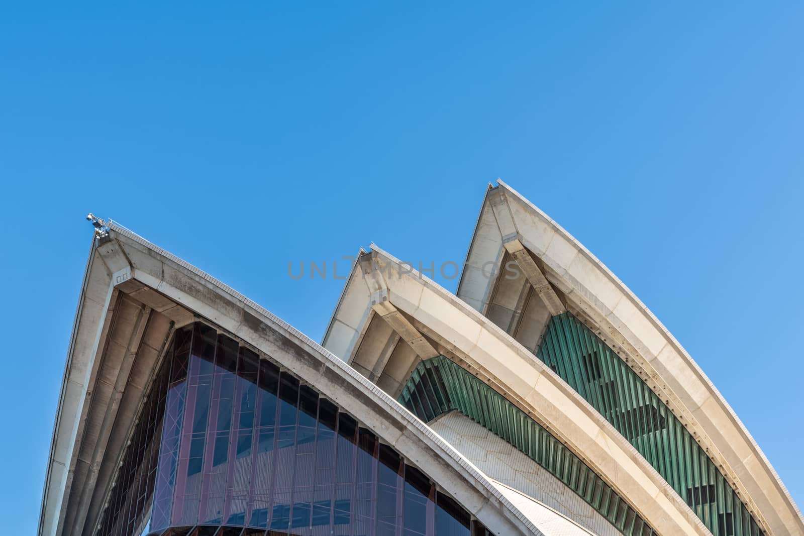 Sydney, Australia - February 11, 2019: Detail of white roof structure of Sydney Opera House against deep blue sky. 5 of 12.