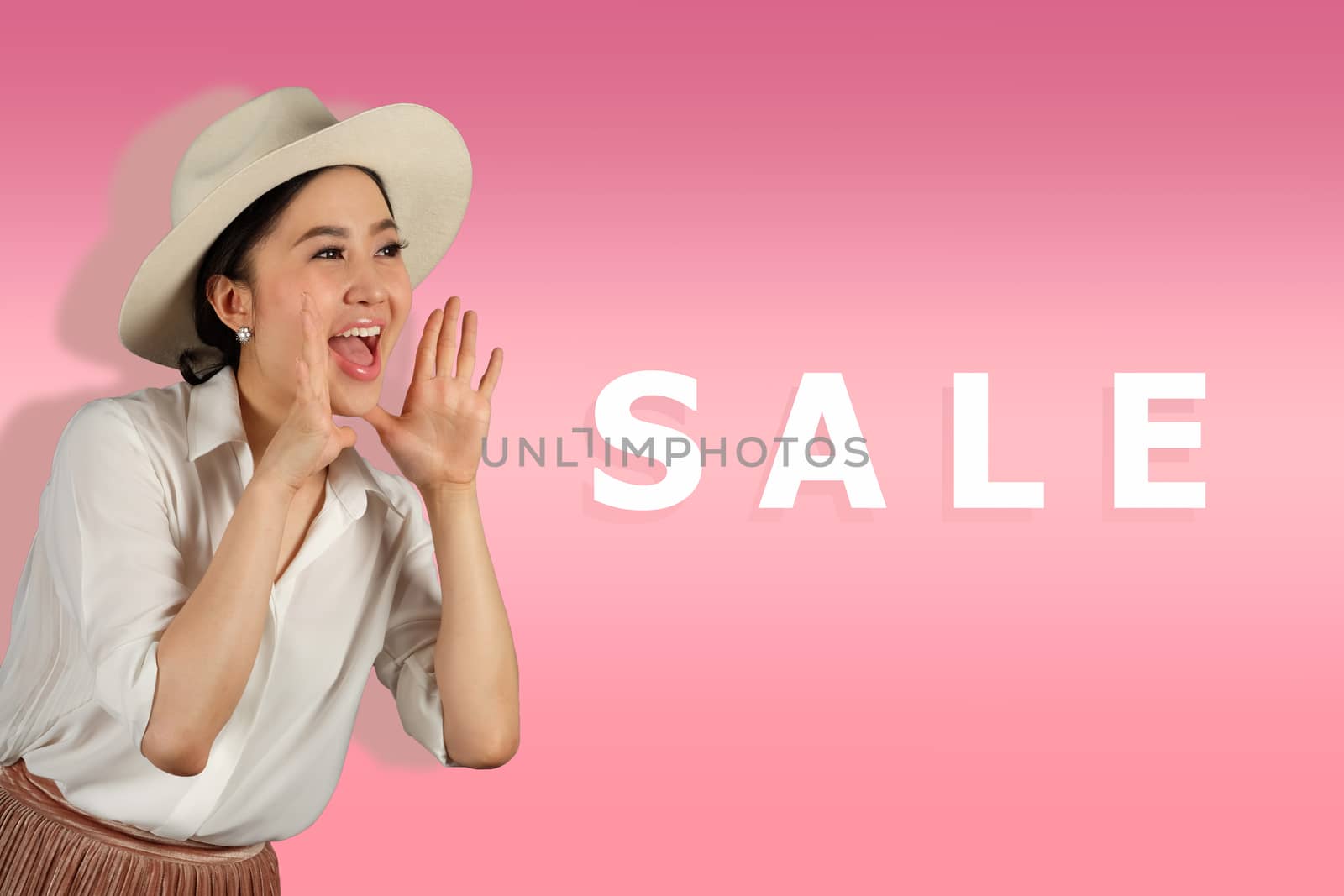 Beautiful young woman shouting on sale word 