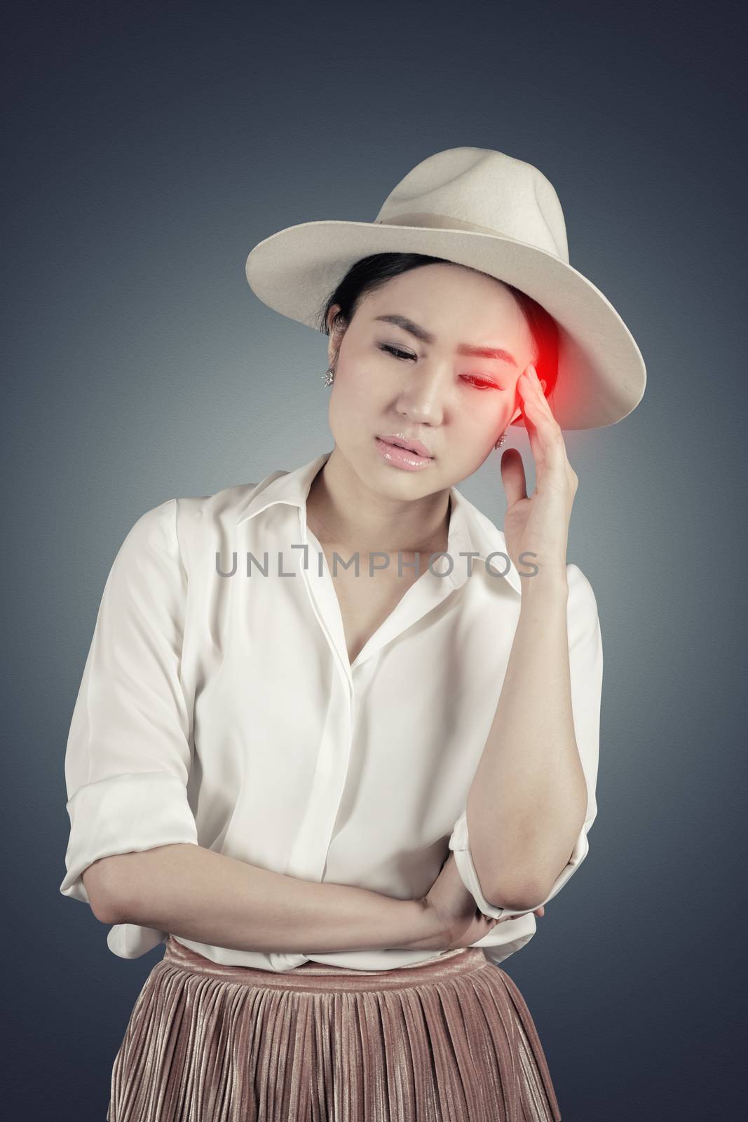 Portrait young woman having headache in dark background with cli by Surasak
