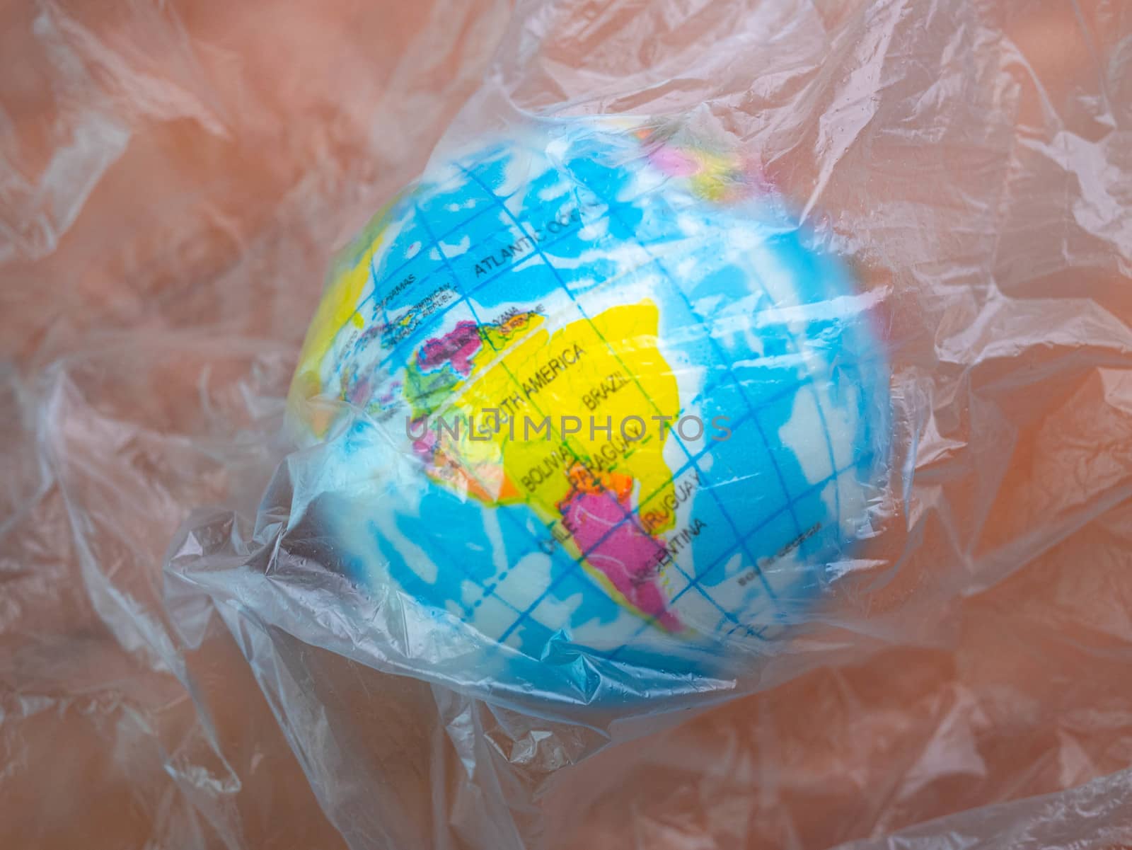 The earth in plastic bag, Global warming due to pollution by plastic debris. The concept of Earth Day.