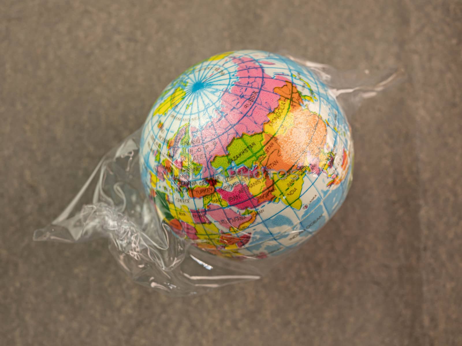 The earth in plastic bag, Global warming due to pollution by plastic debris. The concept of Earth Day.