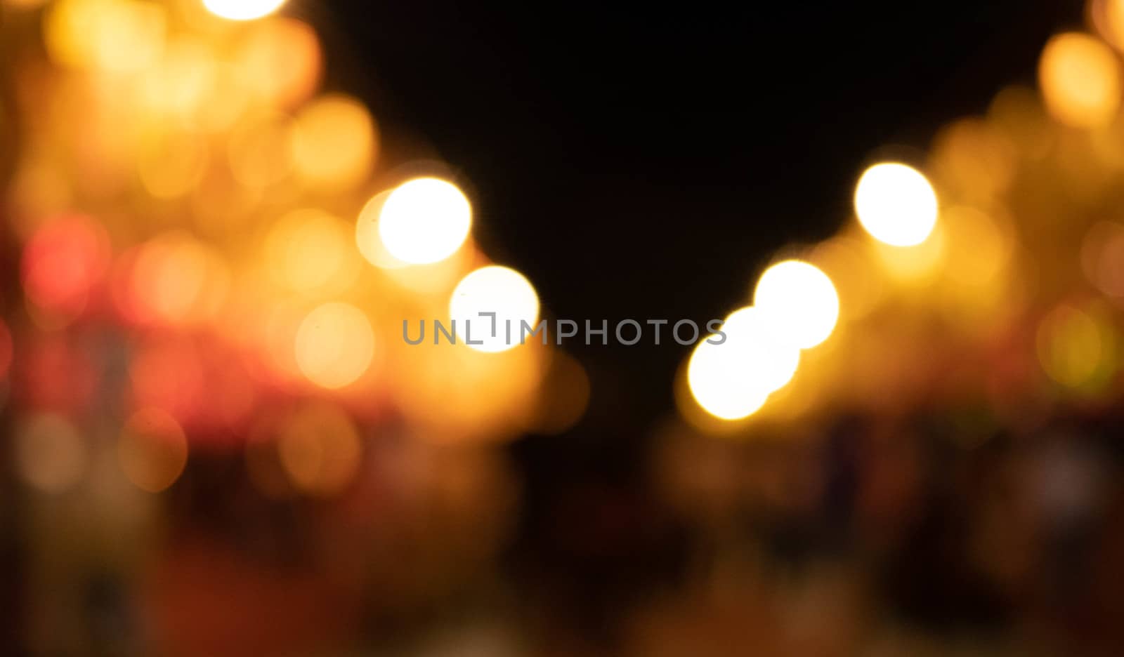 Abstract bokeh background of light from Thai lanna lantern at night.  Concepts of celebration in Yi Peng Festival. by TEERASAK