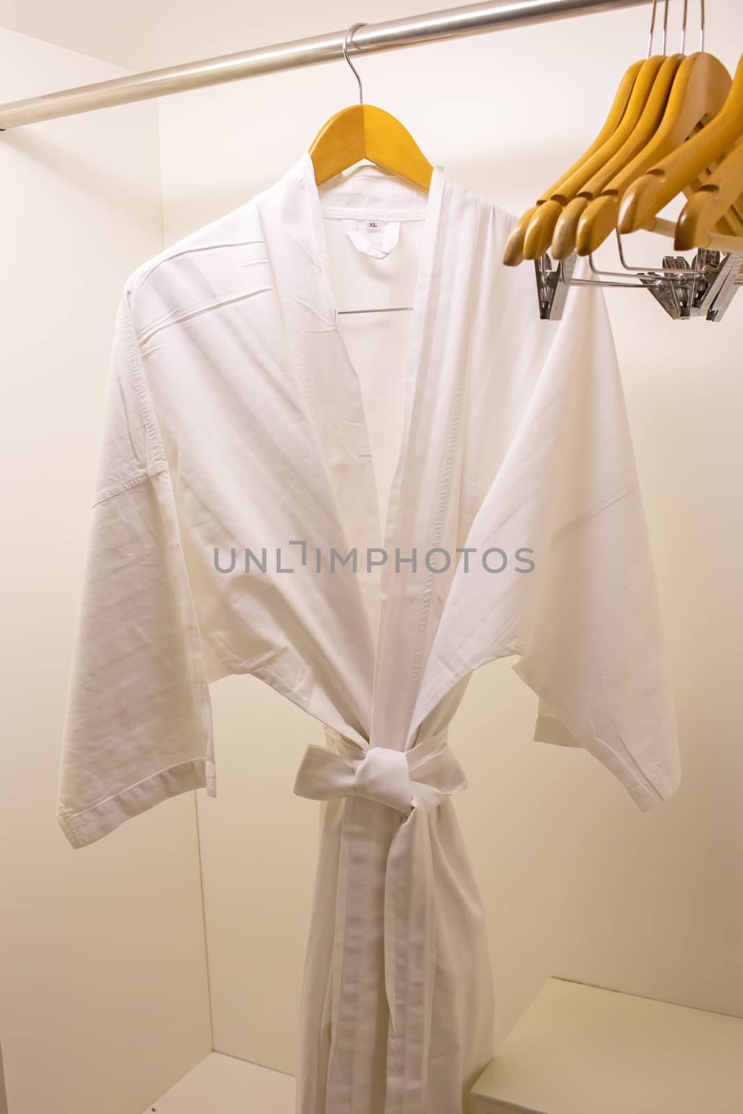 Spa bathrobes hanging in wardrobe by Gobba17