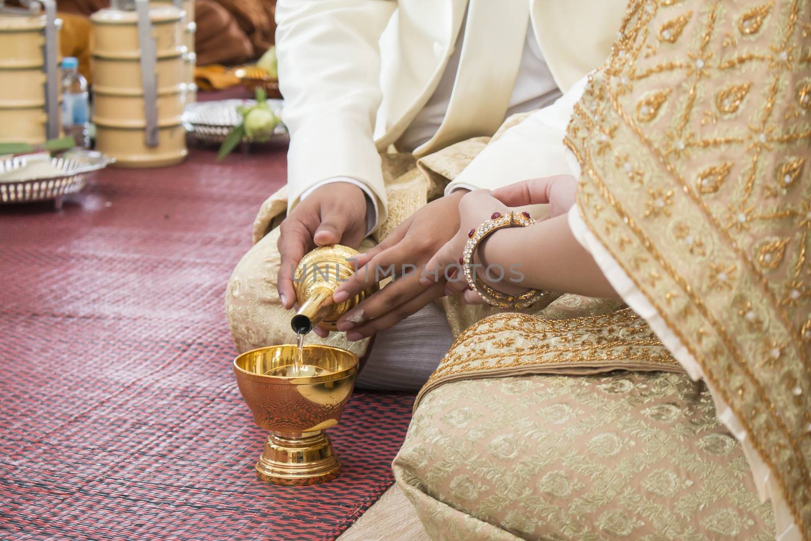 Thai engagement, pour water in Thai wedding