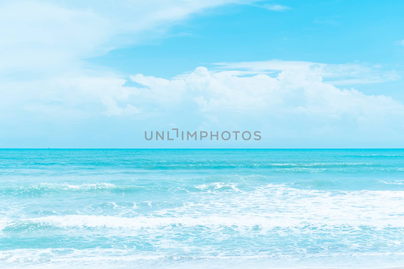 Tropical nature clean beach and white sand in summer with palm tree leaf sun light blue sky and bokeh abstract  background.