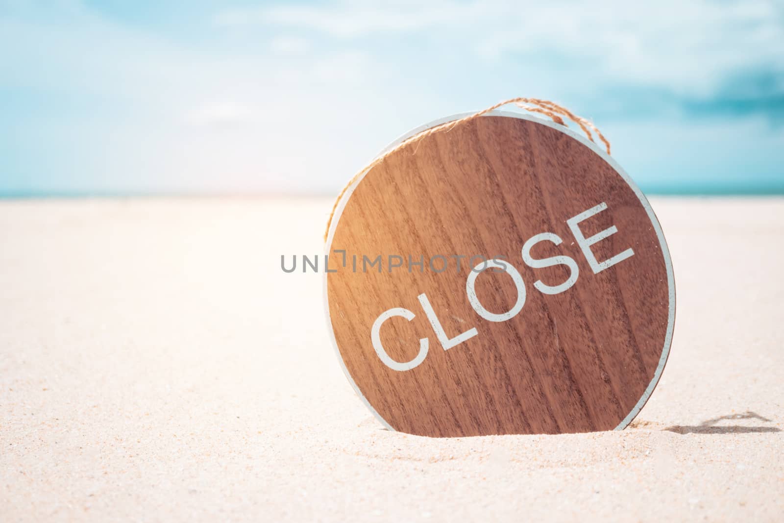 Blur summer bokeh beach with closed sign metaphor no summer or beach is not open background.