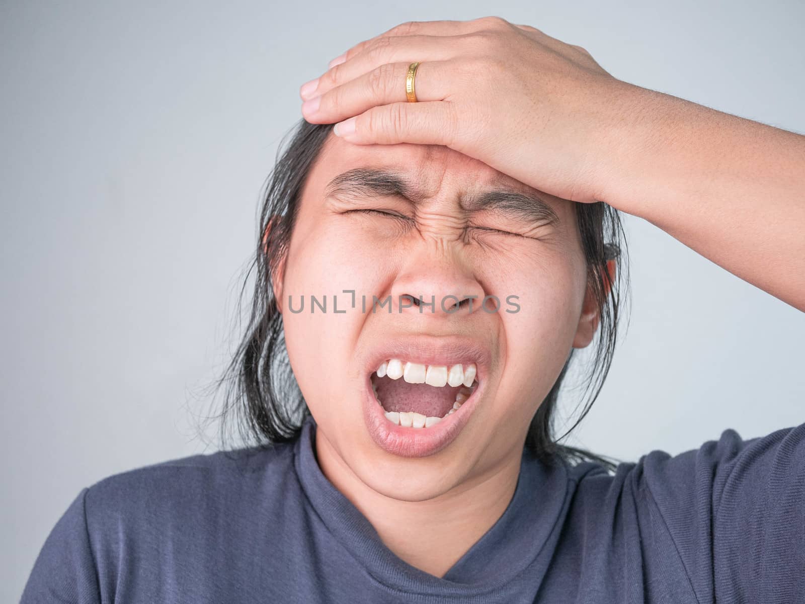 Woman catching on head because she have acute headache. Healthcare and medical concepts.