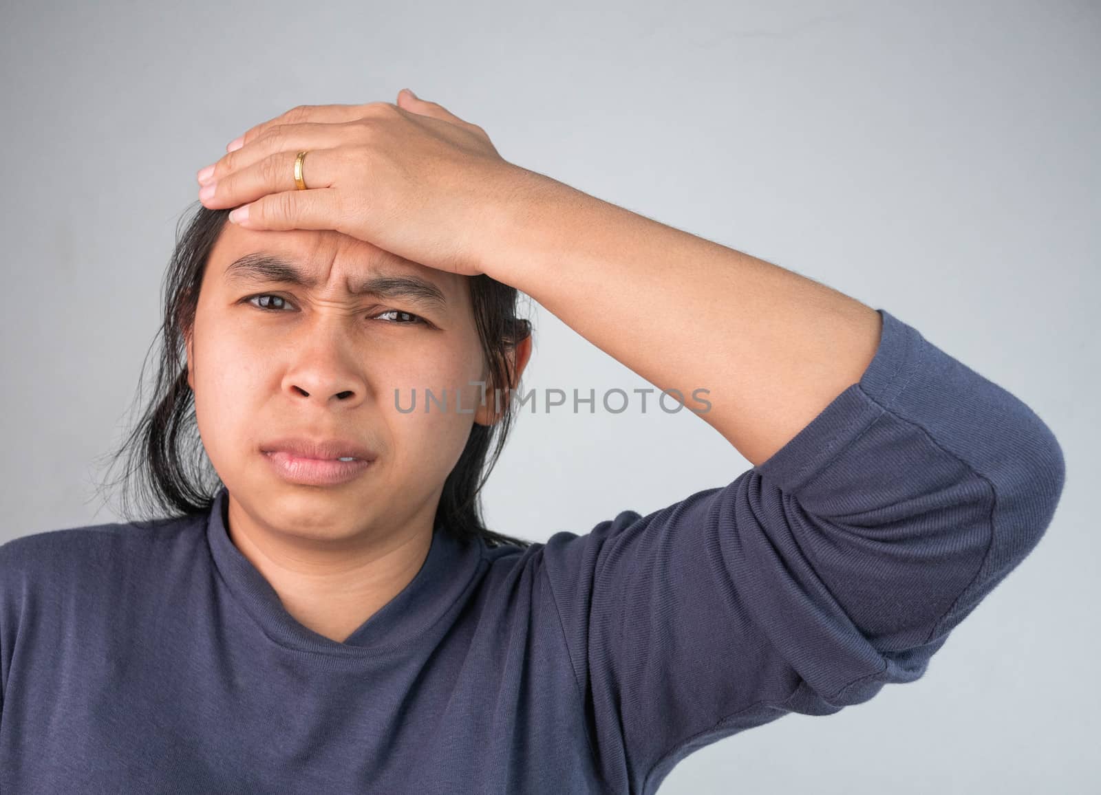 Woman catching on head because she have acute headache. Healthcare and medical concepts.