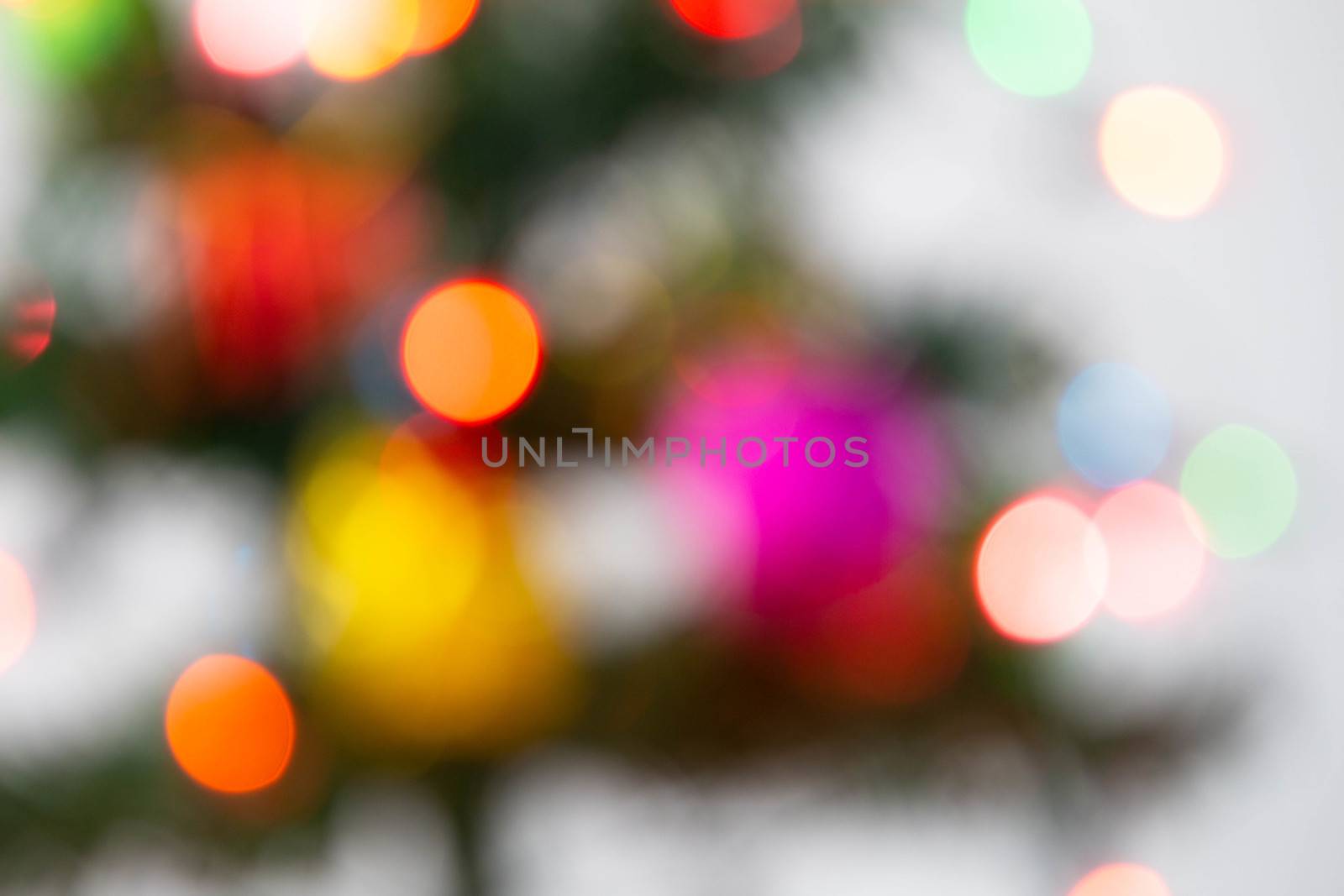 Beautiful decorated christmas tree with defocused lights presents for new year isolated on white background.