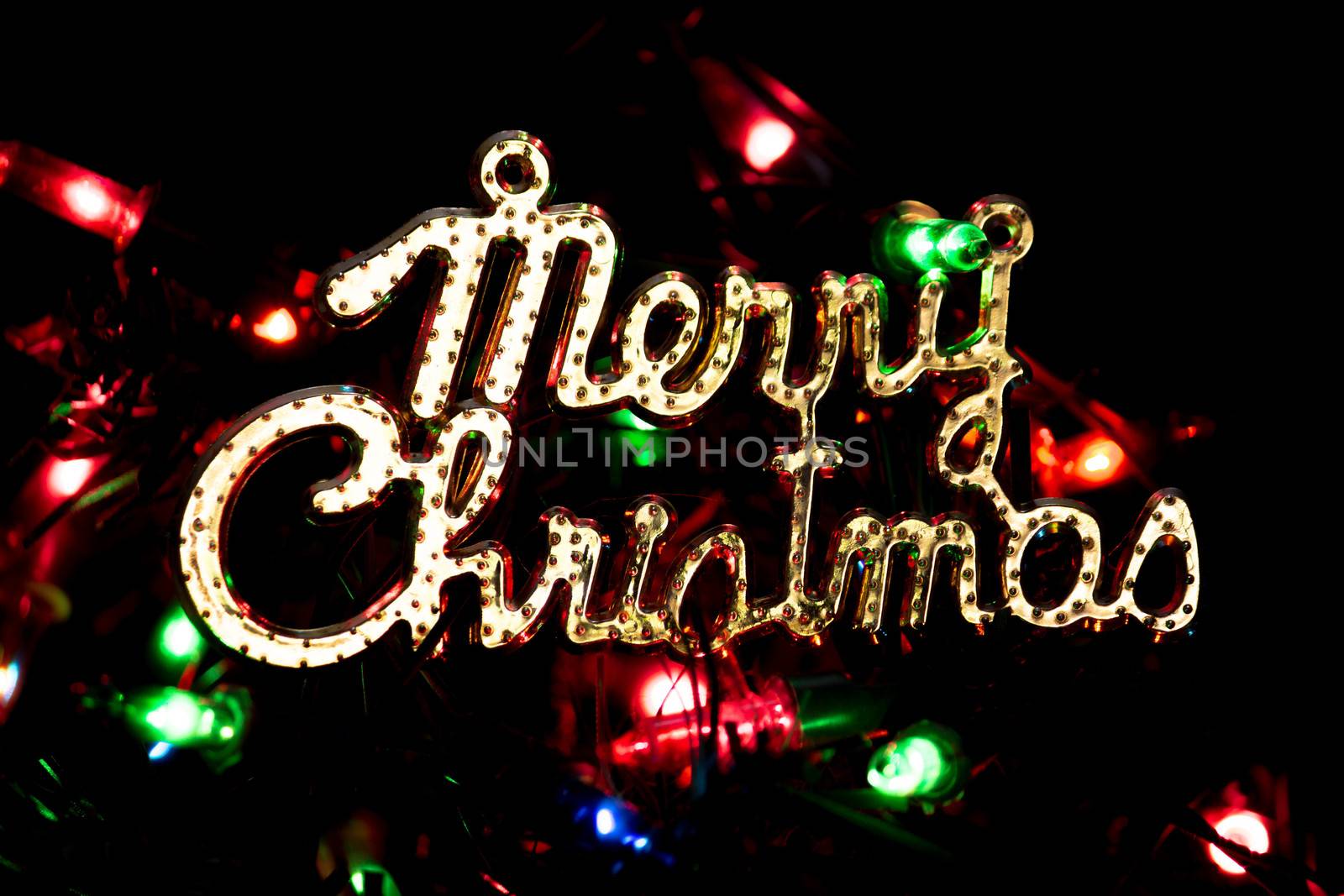 Merry Christmas on dark background with lights bokeh sparkle background presents for new year. by TEERASAK