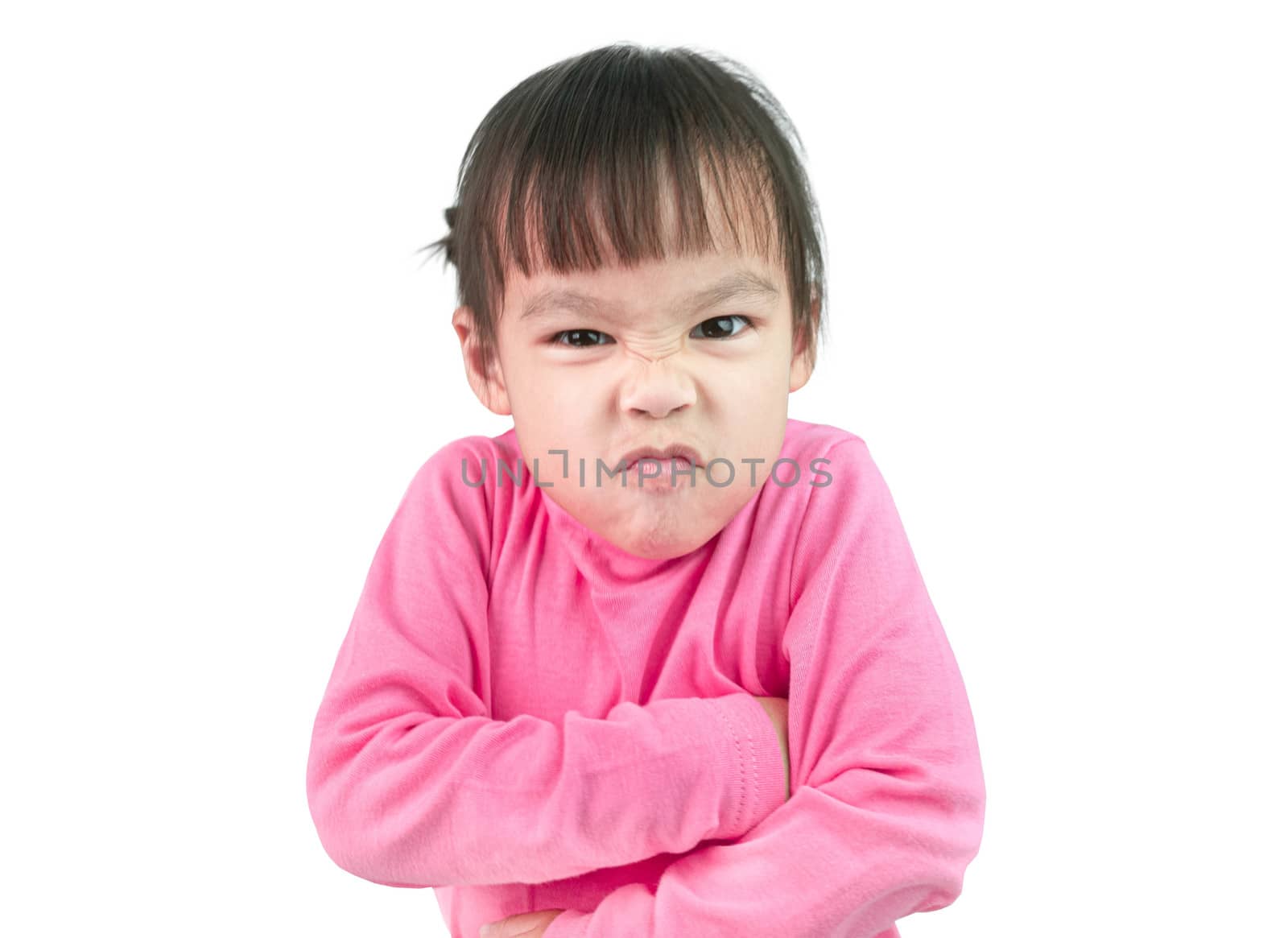 Portrait of angry little child girl and standing with cross one's arm isolated on white background.