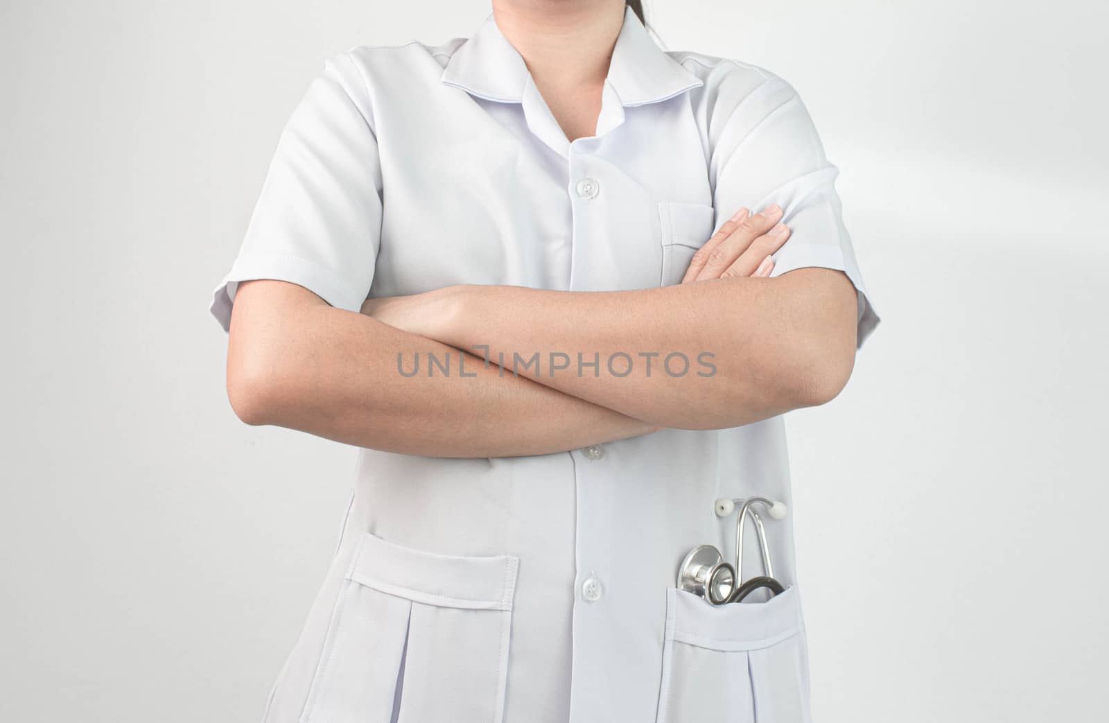 Confident woman doctor posing with arms crossed and stand over white background.