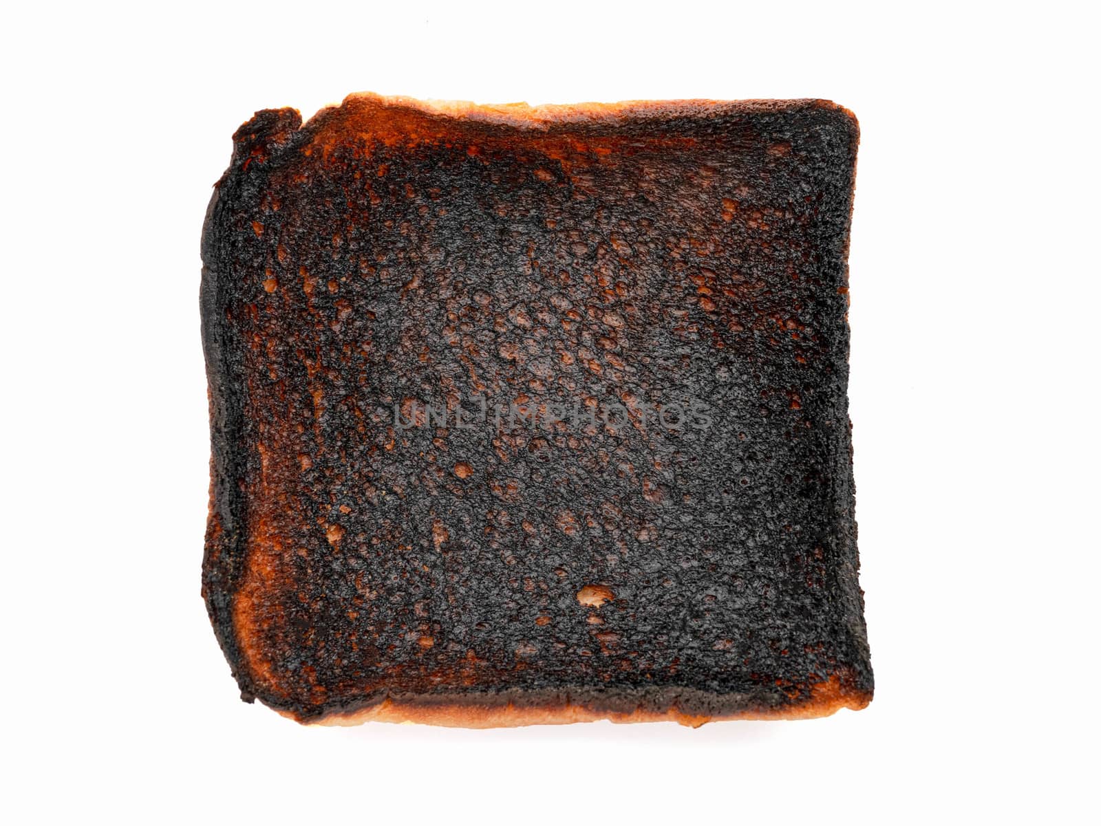 Burnt toast bread slice isolated on white background. by TEERASAK