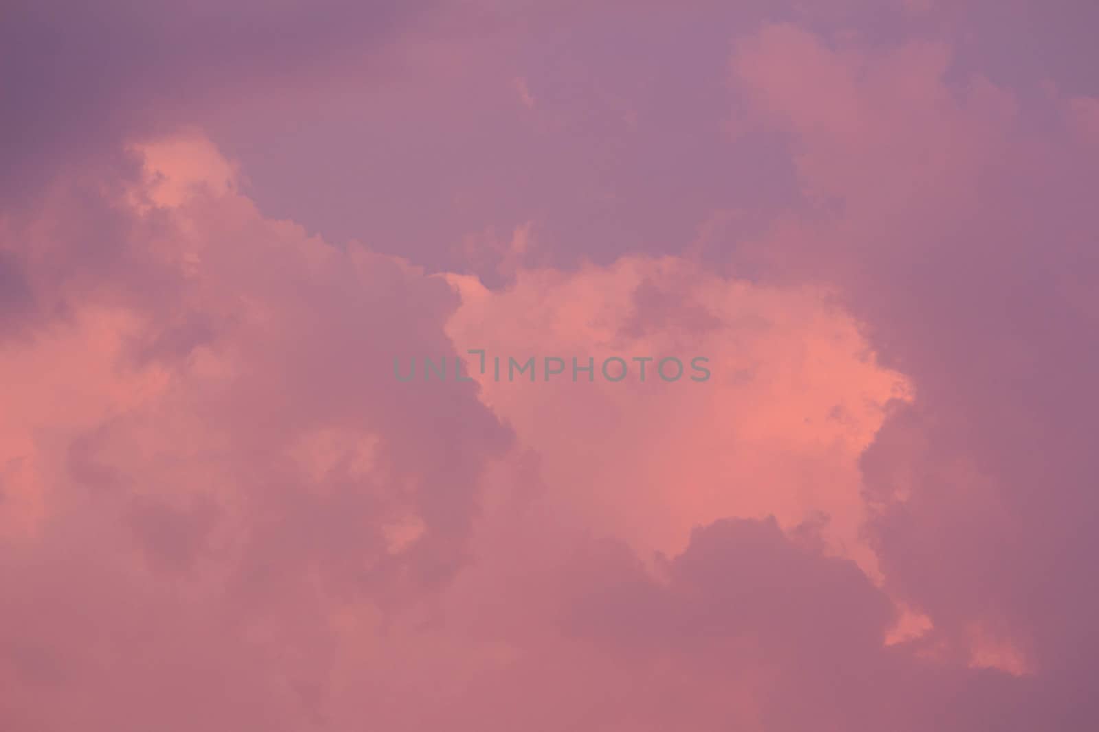 Beautiful sunset sky with clouds on hot summer day. Nature background.