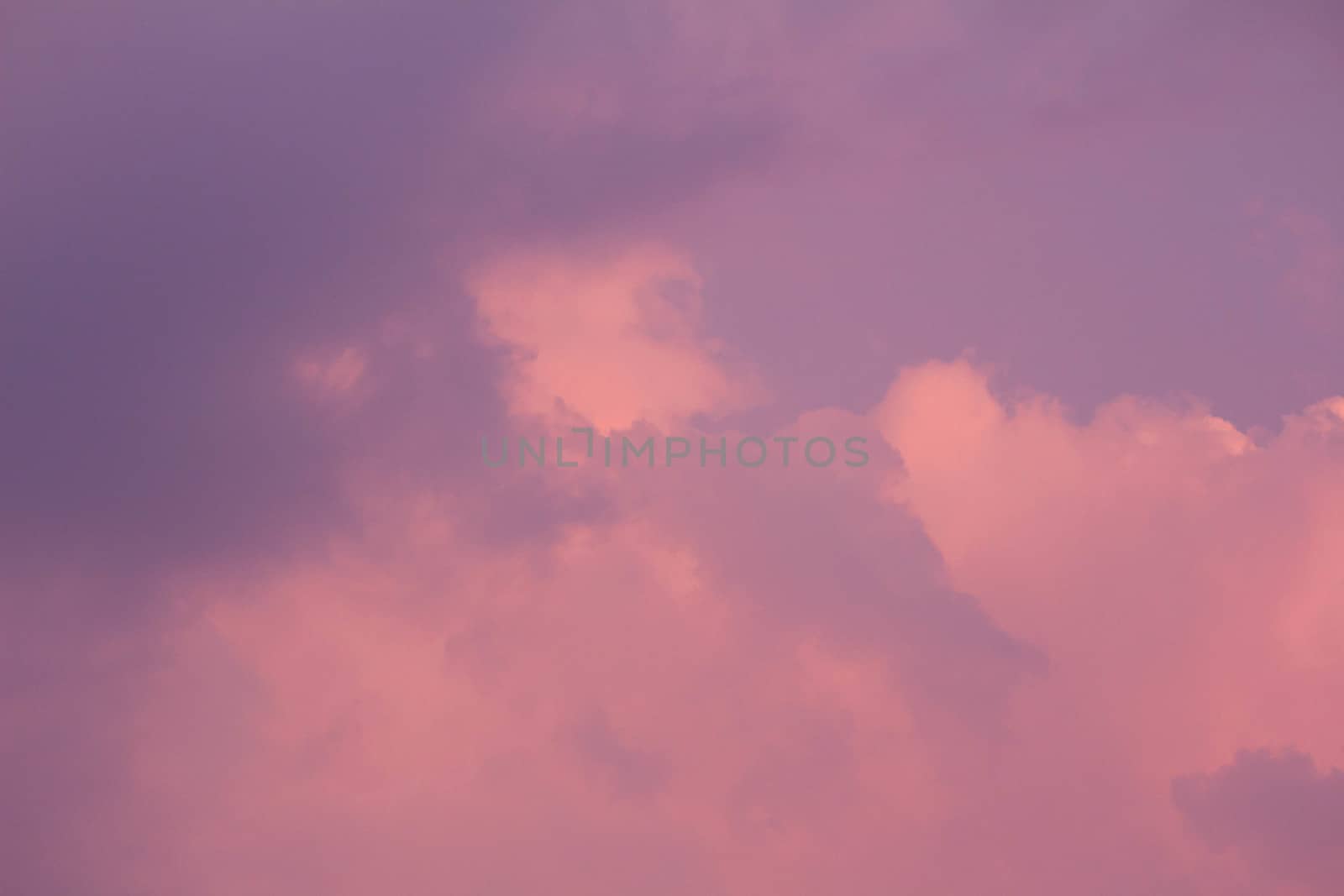 Beautiful sunset sky with clouds on hot summer day. Nature background.
