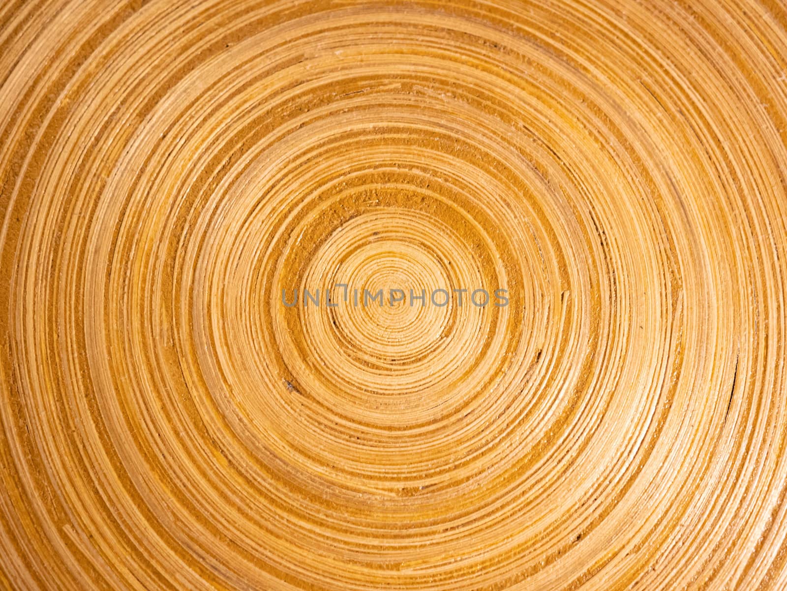 Close up surface of handmade something, made from bamboo sheet roll in a circle, used for decorating a vintage style room. by TEERASAK