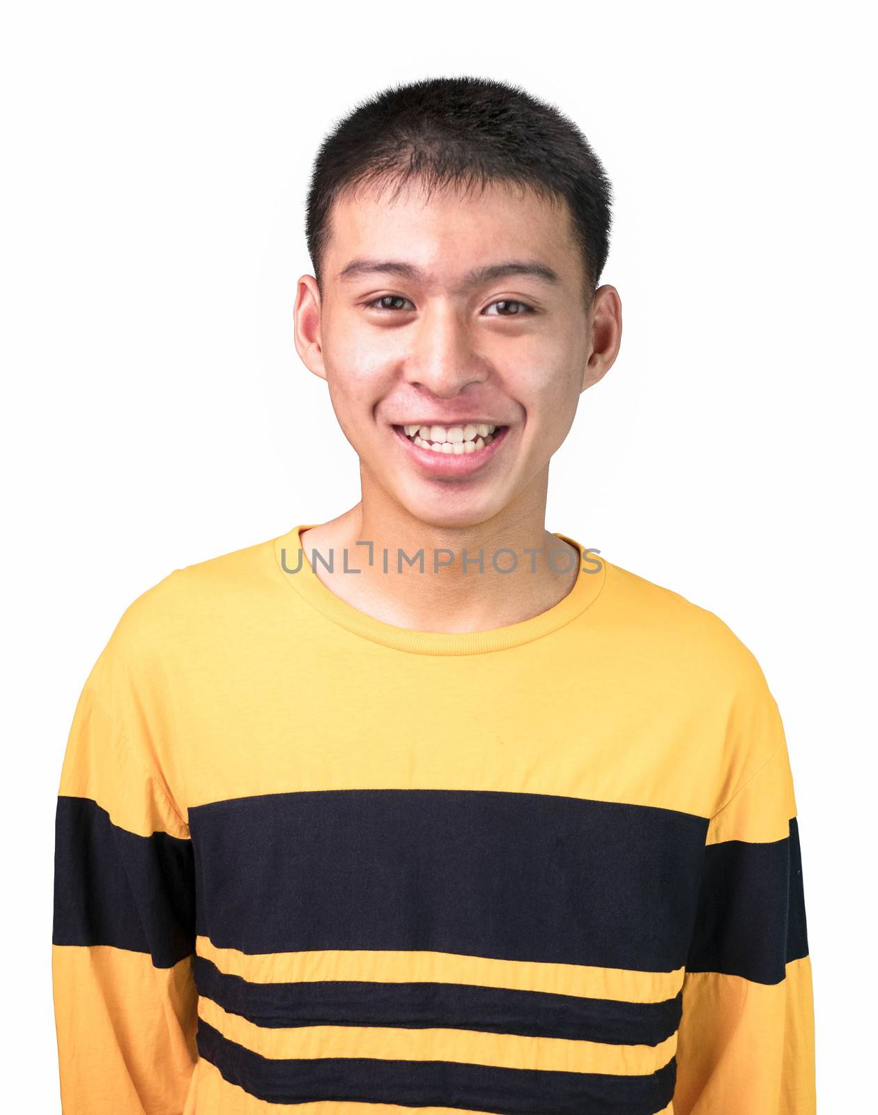 Close up portrait of a smiling handsome teenager boy in yellow long sleeve t-shirt, stand over white background. lifestyle people concept.