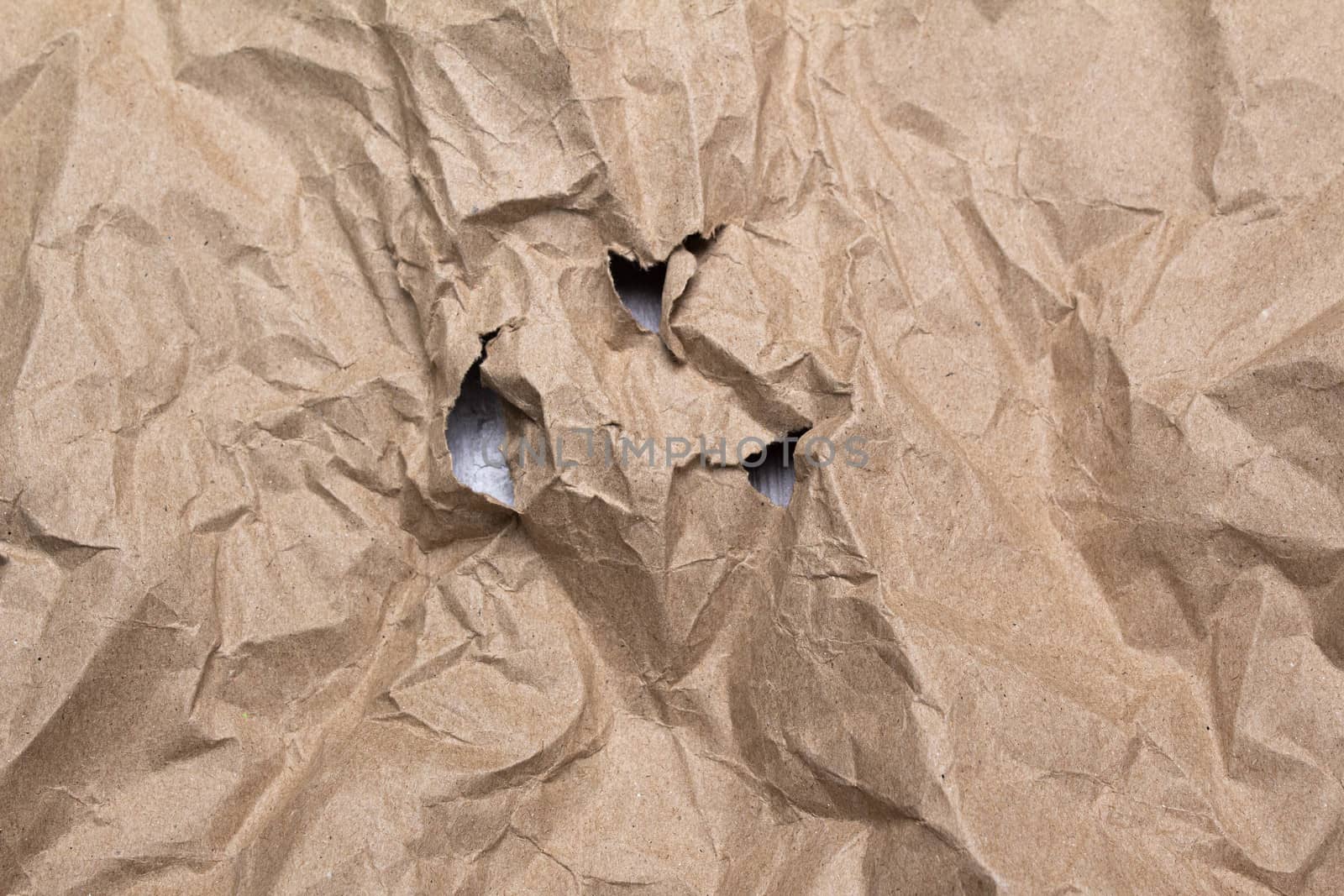 Close up of crumpled brown paper texture and torn. by TEERASAK