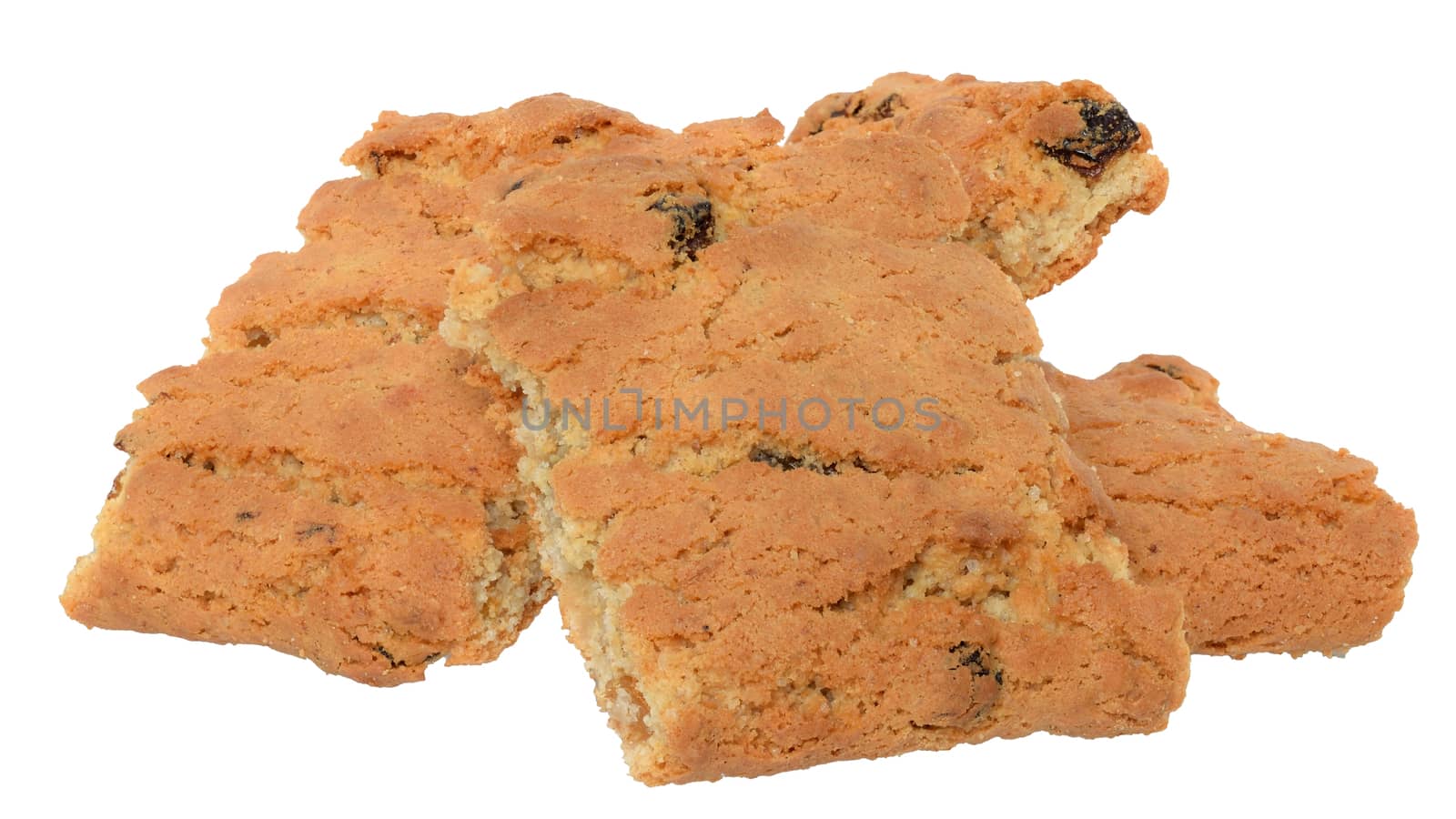 Appetizing chip cookies with raisins and candied fruit close-up tower isolated on white background. 