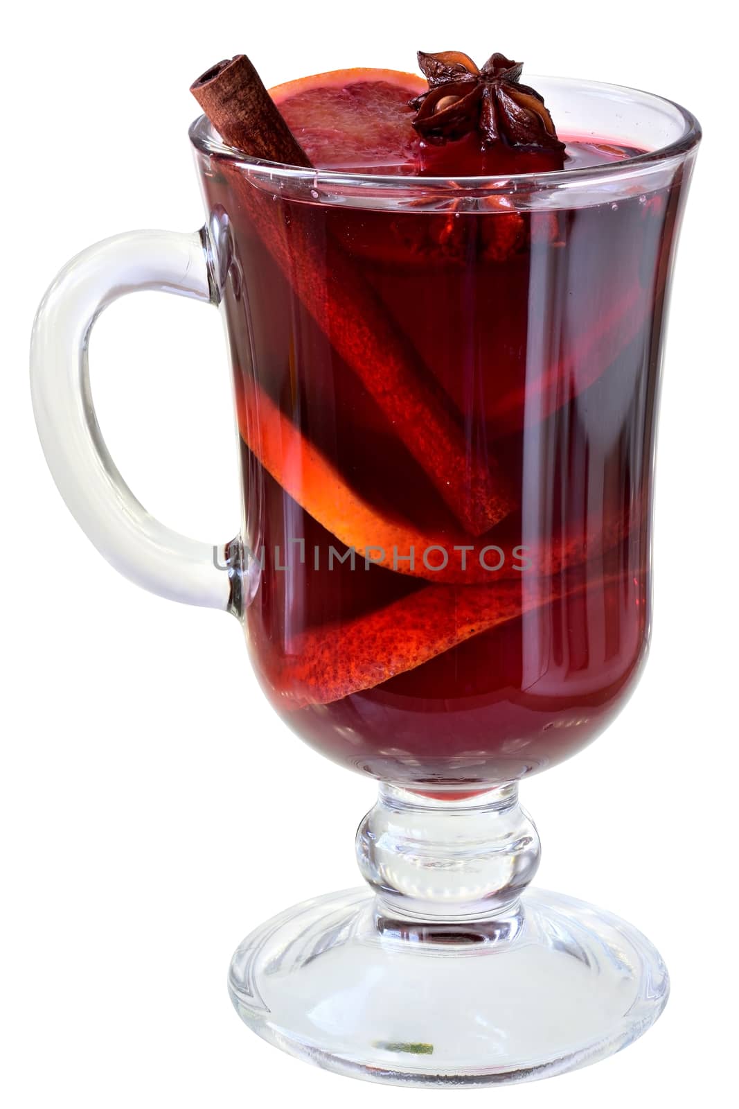 Hot drink mulled red wine with spices and red orange in a glass goblet isolated on white background.