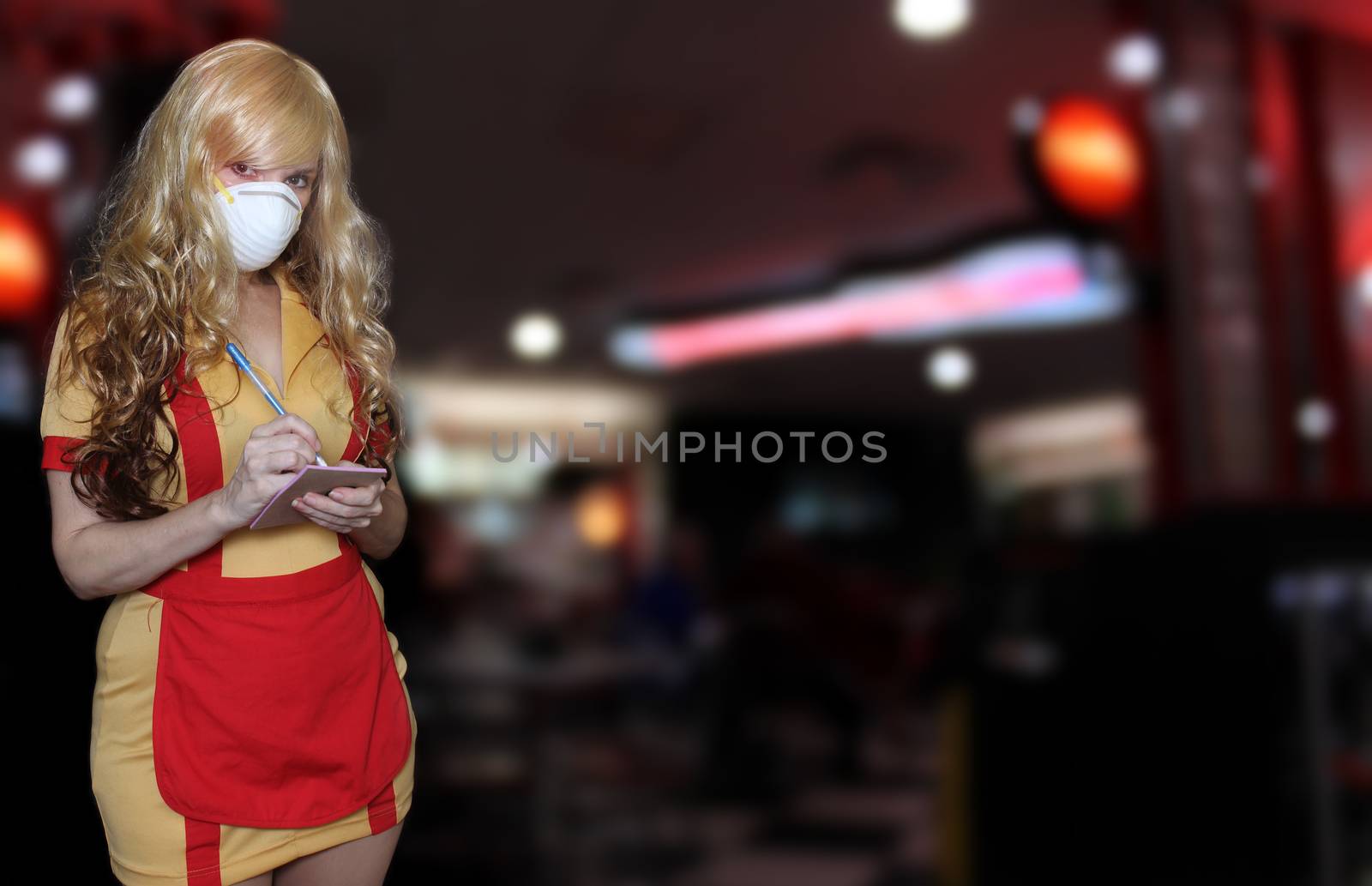 Waitress Wearing N95 Mask With Blurred Restaurant Background