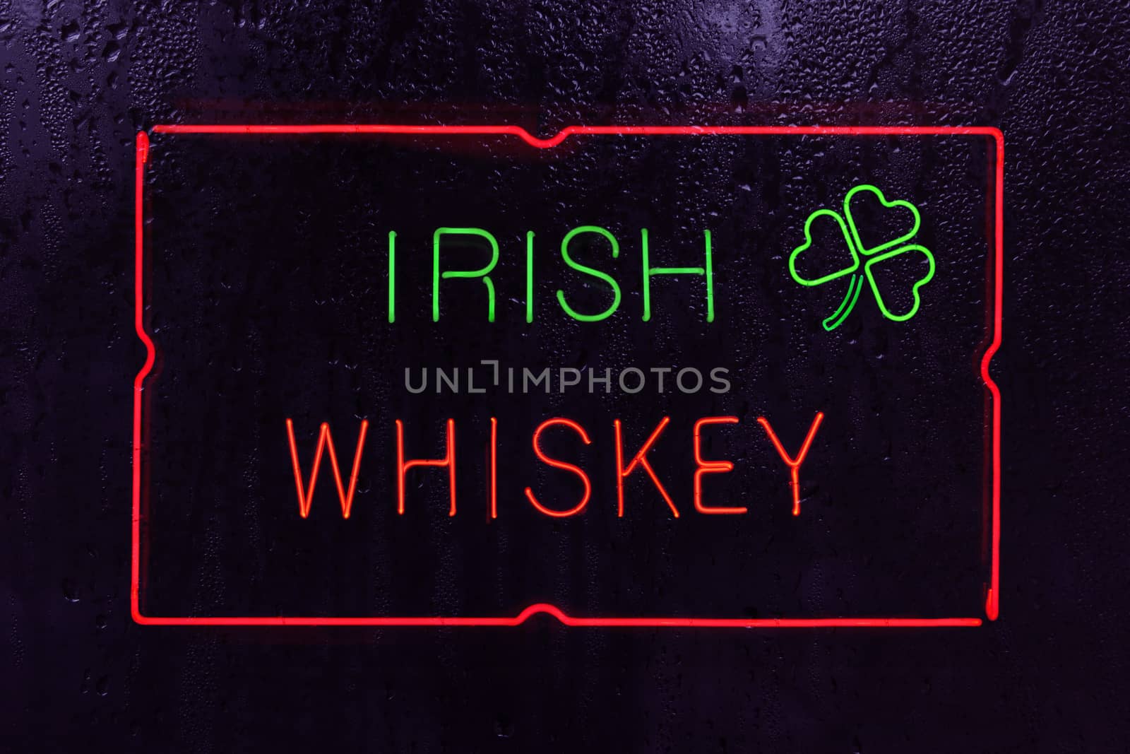 Vintage Neon Irish Whiskey Sign in Rainy Window