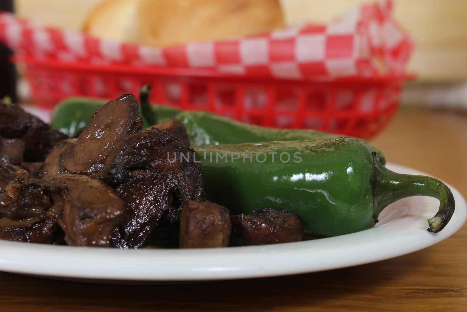 Roasted Green Jalapeno Peppers With Mushrooms Shallow DOF Focus on mushrooms