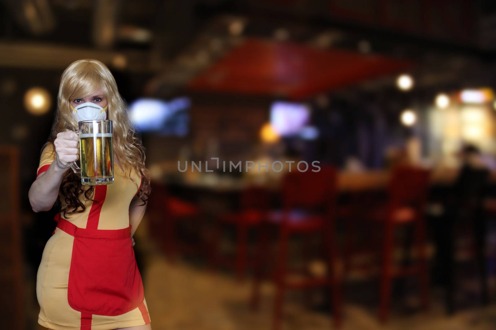 Waitress Wearing N95 Mask With Blurred Restaurant Background