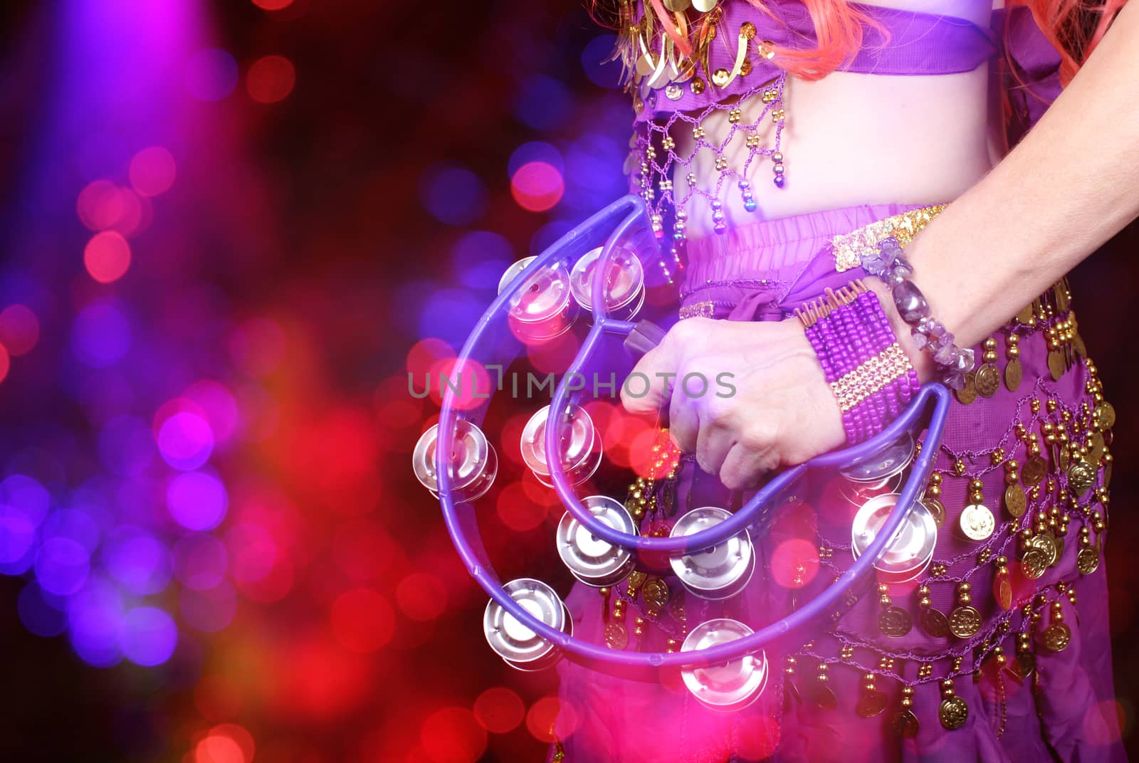 Belly Dancer Wearing Purple Closeup With Tambourine