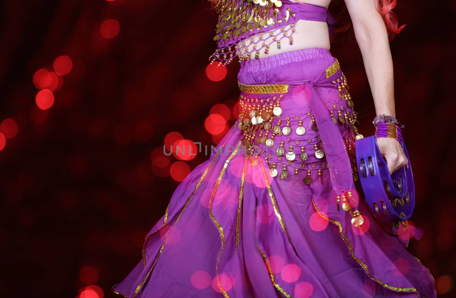 Belly Dancer Wearing Purple Closeup With Tambourine