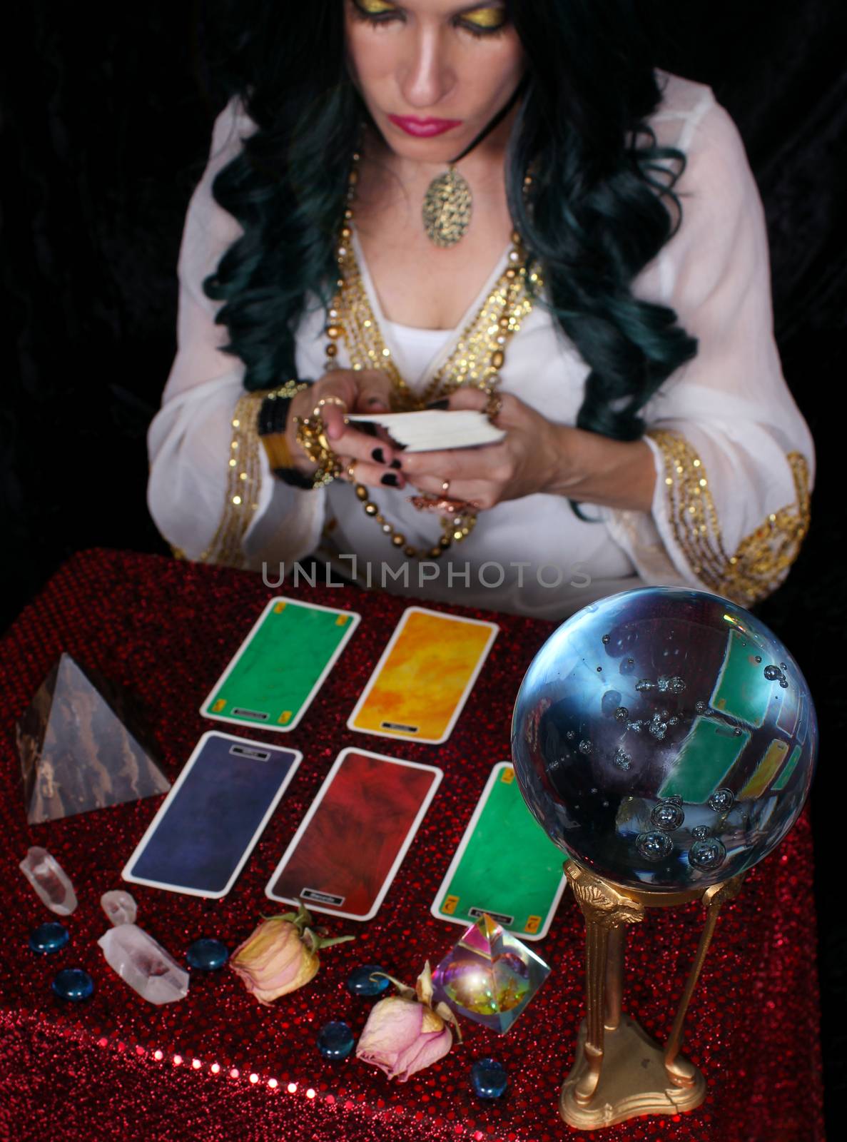 Psychic with green hair  Crystal Ball and tarot cards Shallow DOF, Focus on Crystal Ball