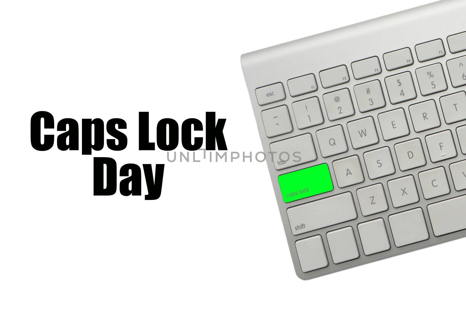 CAPS LOCK DAY text and computer keyboard on white background by silverwings