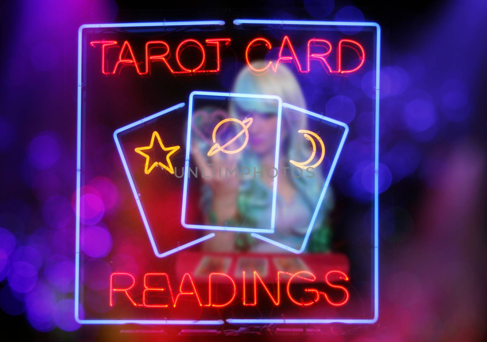 Tarot Card Readings Neon Sign in Window with Psychic Tarot Card Reader blurred in background