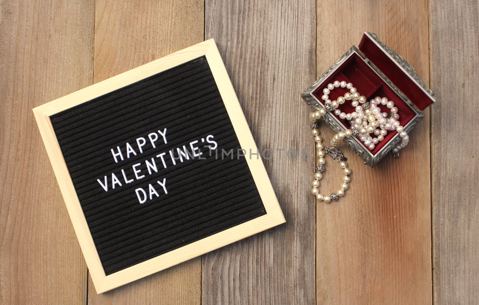 Happy Valentines Day Sign With Rose and Jewelry Box on Wooden Background