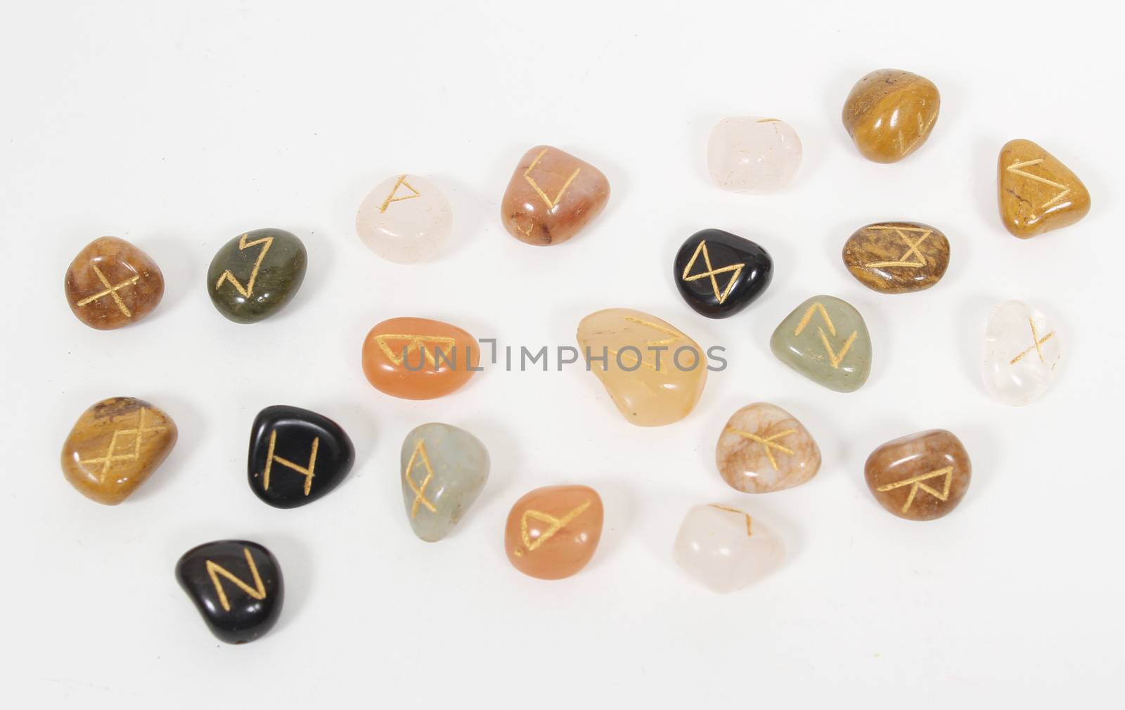 Rune Stones on natural stone with white background