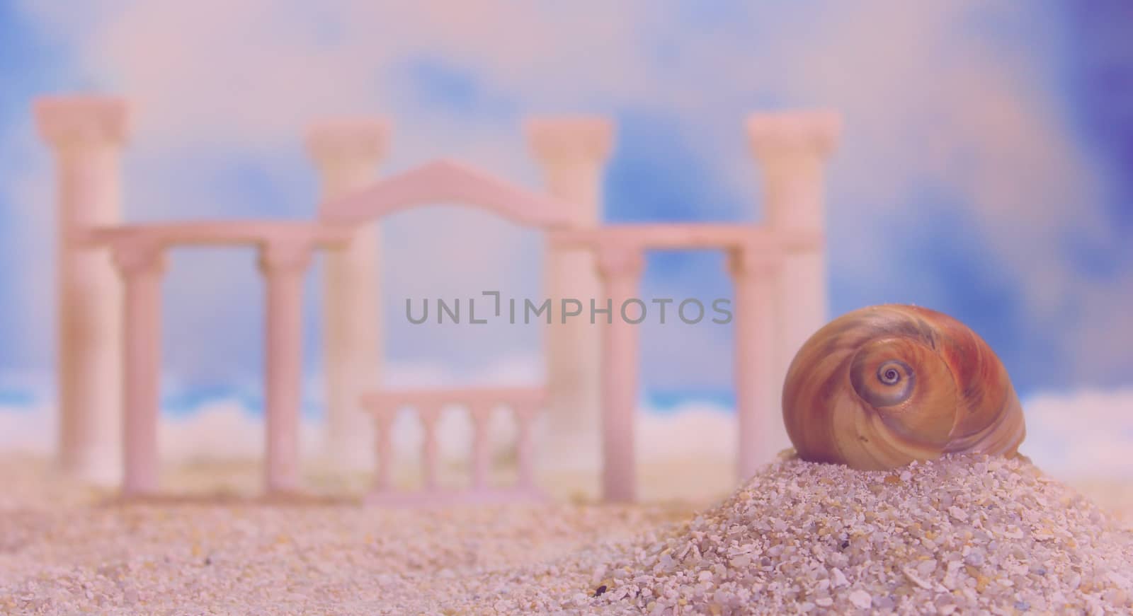 Seashell on Tropical Beach With Roman Style Ruins
