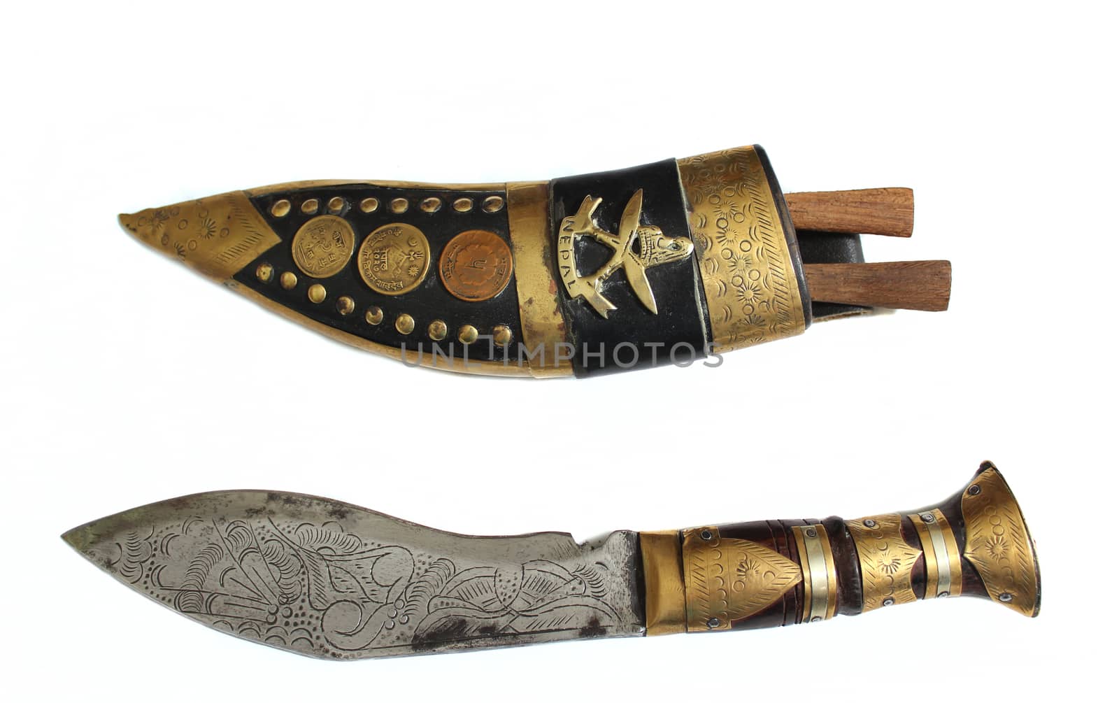 Antique Knife From Nepal on White Background Writing on Coins is government issue coin and monetary denomination
