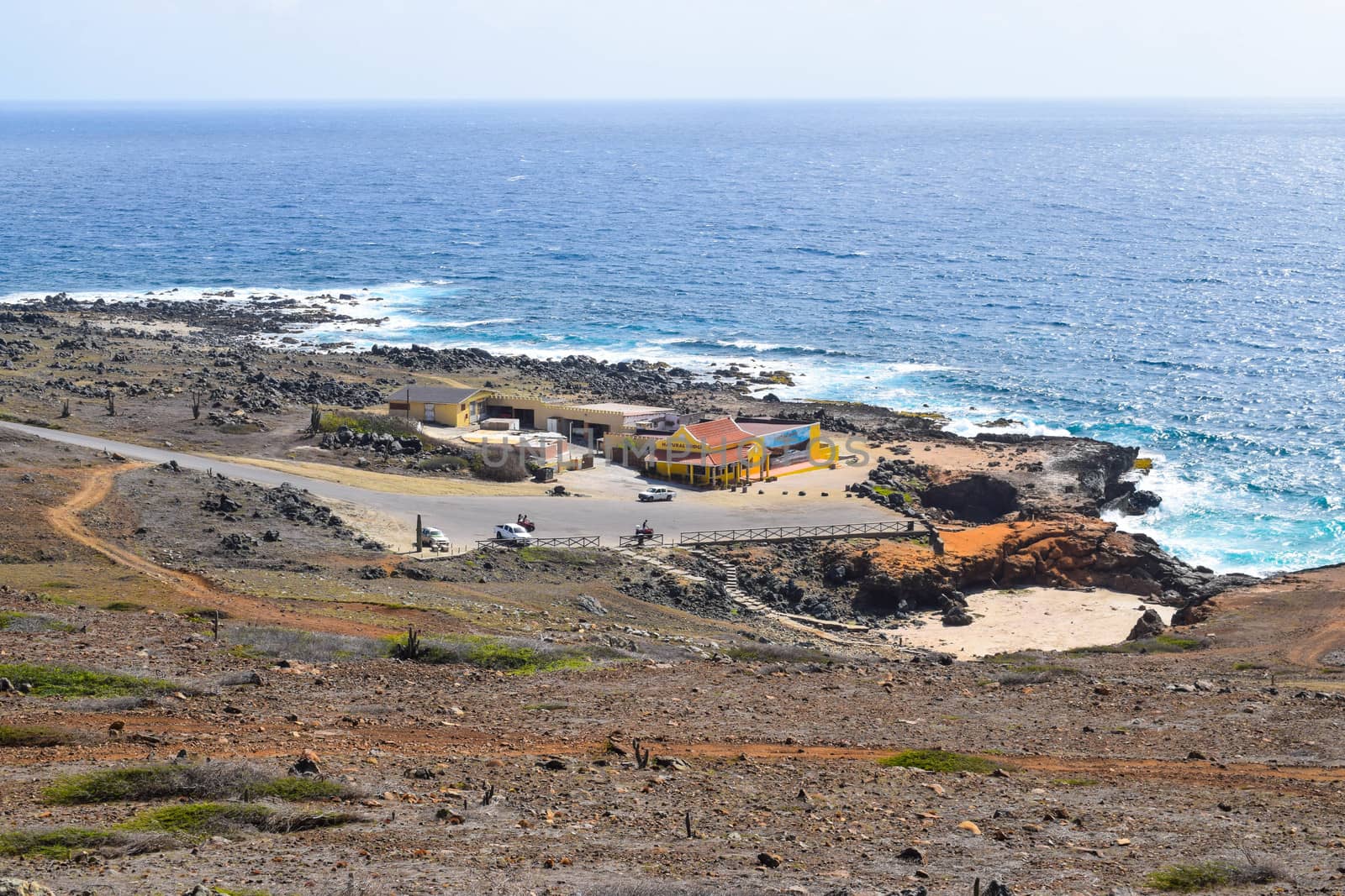 Arikok Natural Park on the island of Aruba in the Caribbean Sea with deserts and ocean waves on the rocky coast