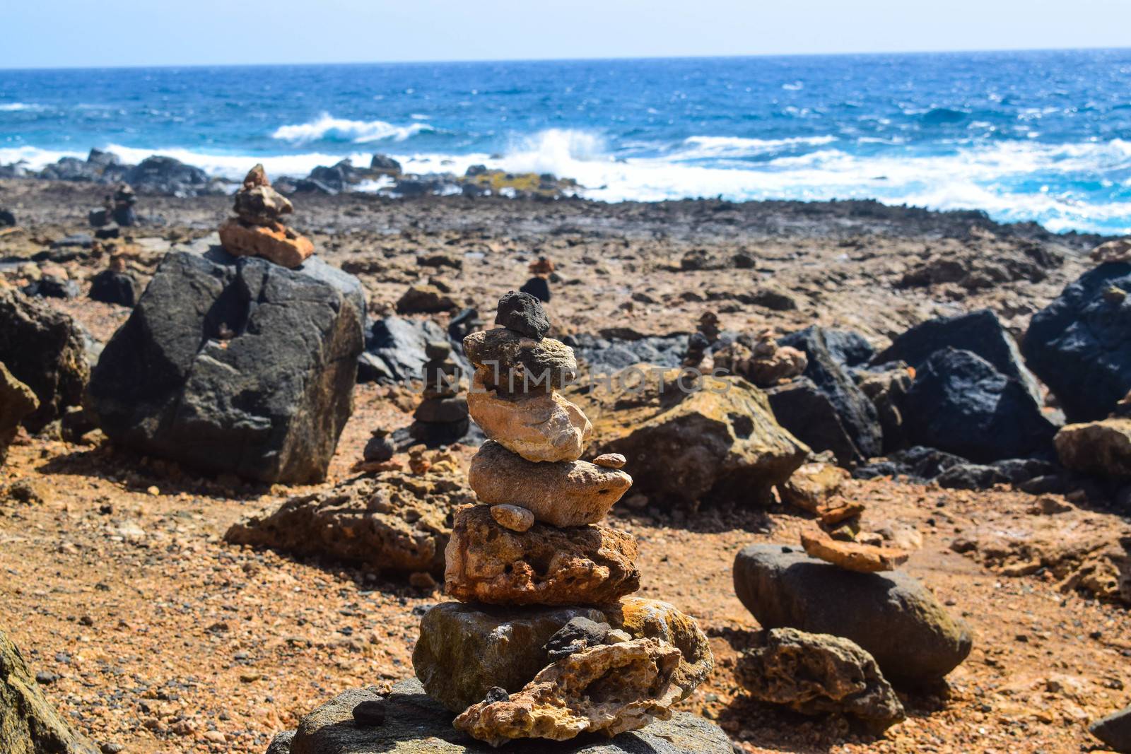 Arikok Natural Park on the island of Aruba in the Caribbean Sea with deserts and ocean waves on the rocky coast