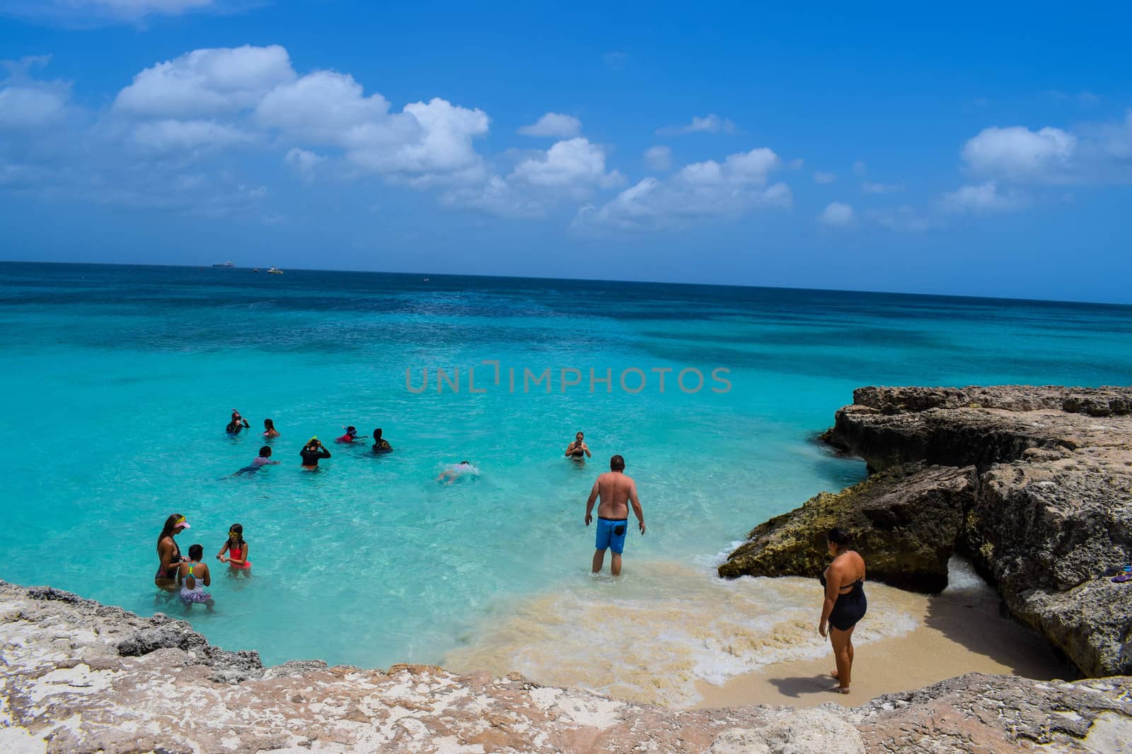 Arikok Natural Park on the island of Aruba in the Caribbean Sea with deserts and ocean waves on the rocky coast by matteobartolini