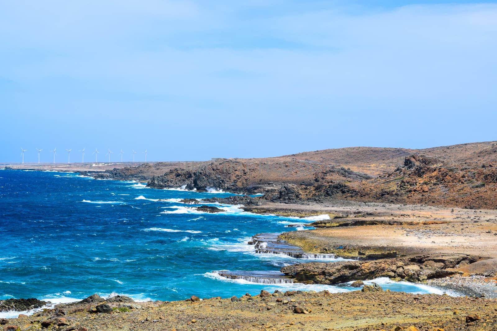 Arikok Natural Park on the island of Aruba in the Caribbean Sea with deserts and ocean waves on the rocky coast
