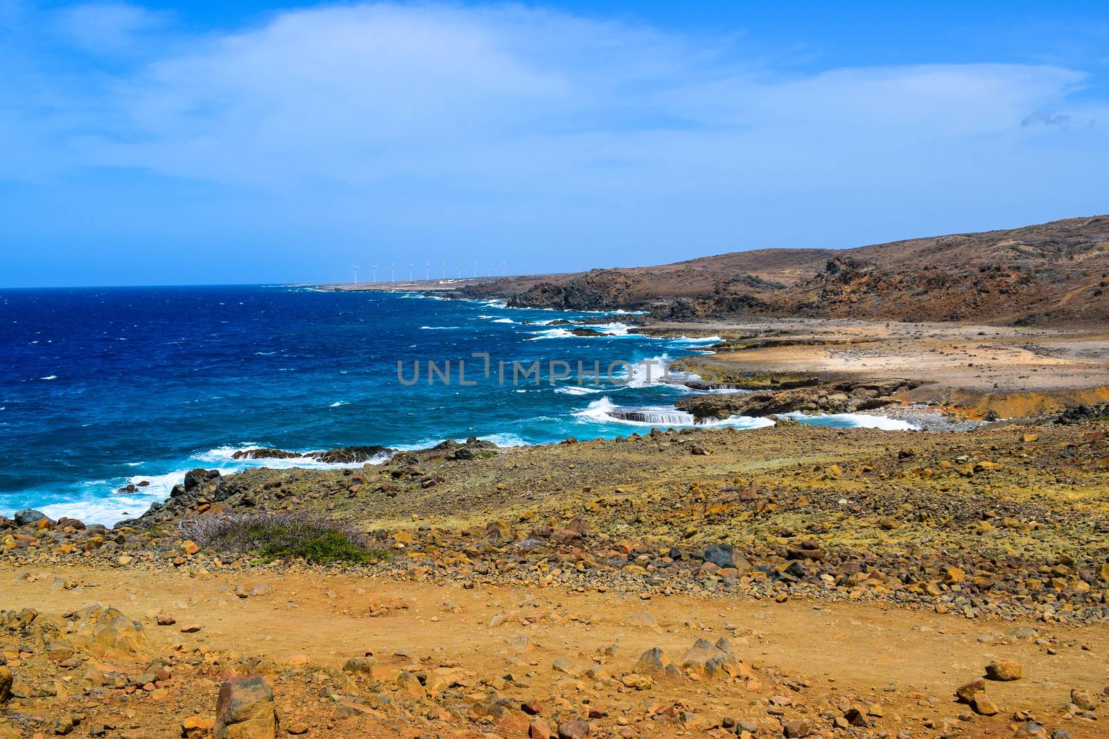 Arikok Natural Park on the island of Aruba in the Caribbean Sea with deserts and ocean waves on the rocky coast