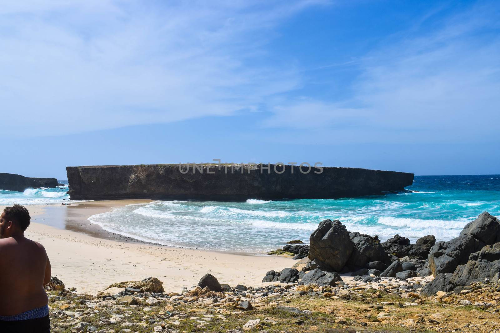 Arikok Natural Park on the island of Aruba in the Caribbean Sea with deserts and ocean waves on the rocky coast