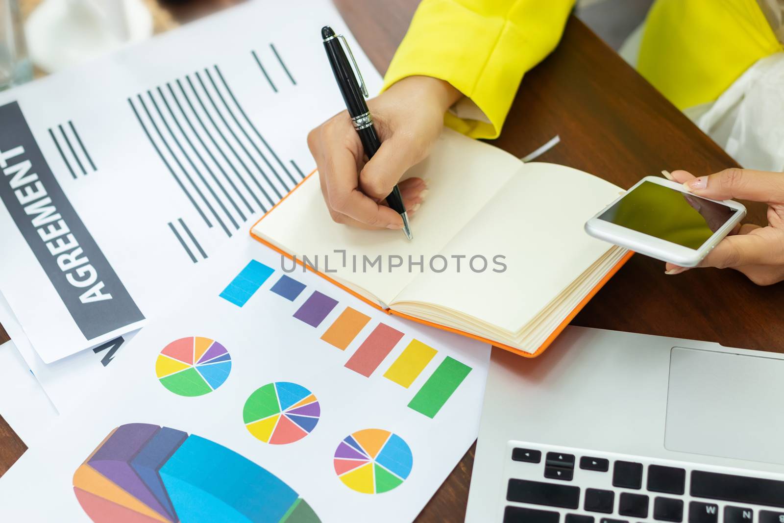 a businesswoman working plan the business and analysis many chart graph at office workplace