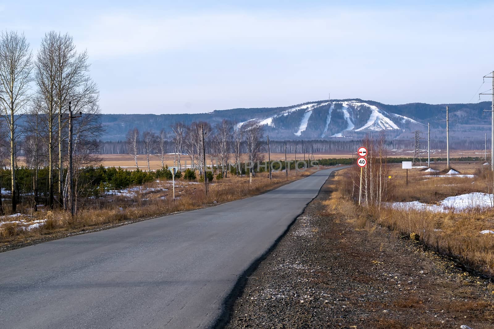 view with asphalt road to the alpine skiing mountain