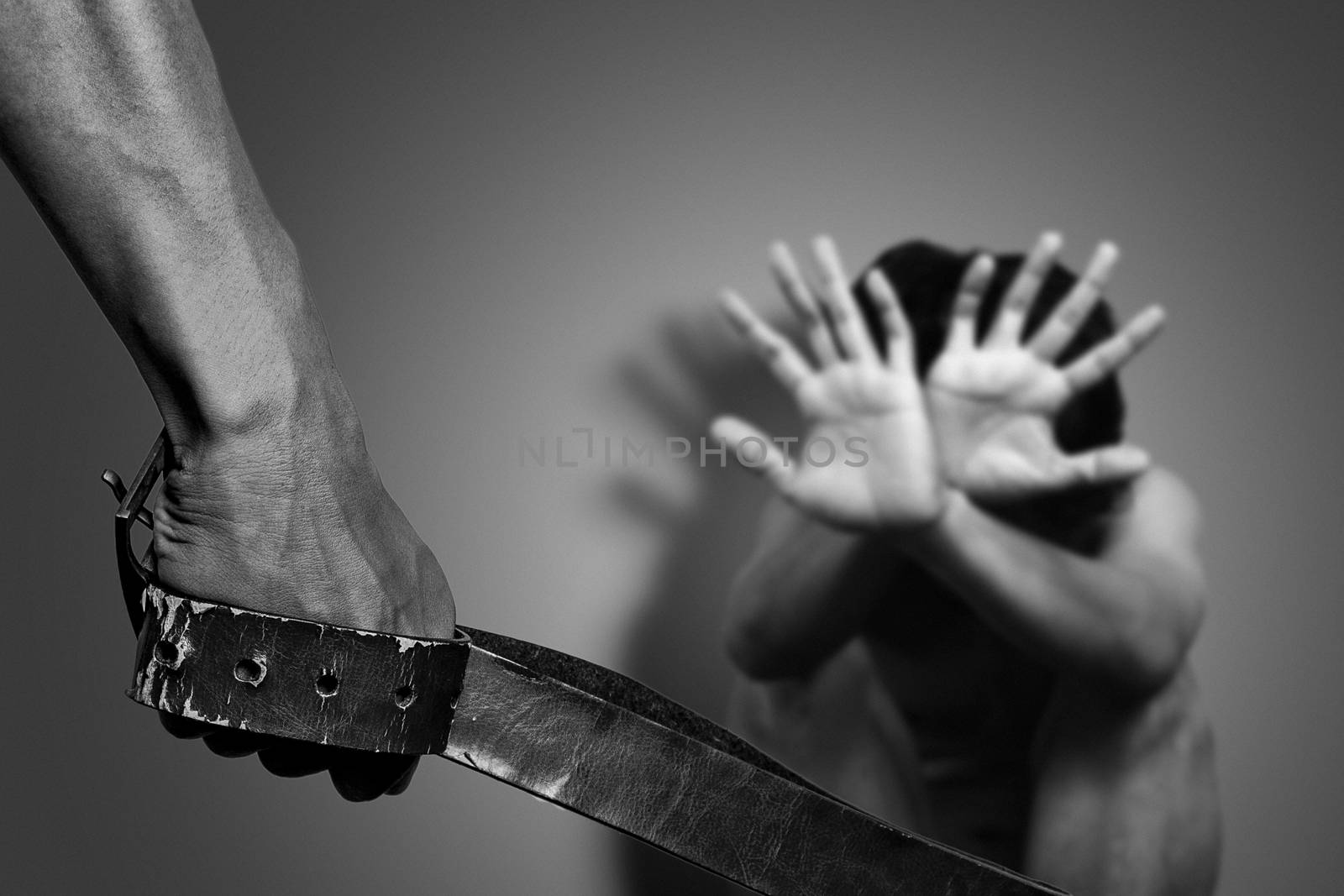 man use belts to hit and injure the others. campaign to stop using violence against others concept. by asiandelight