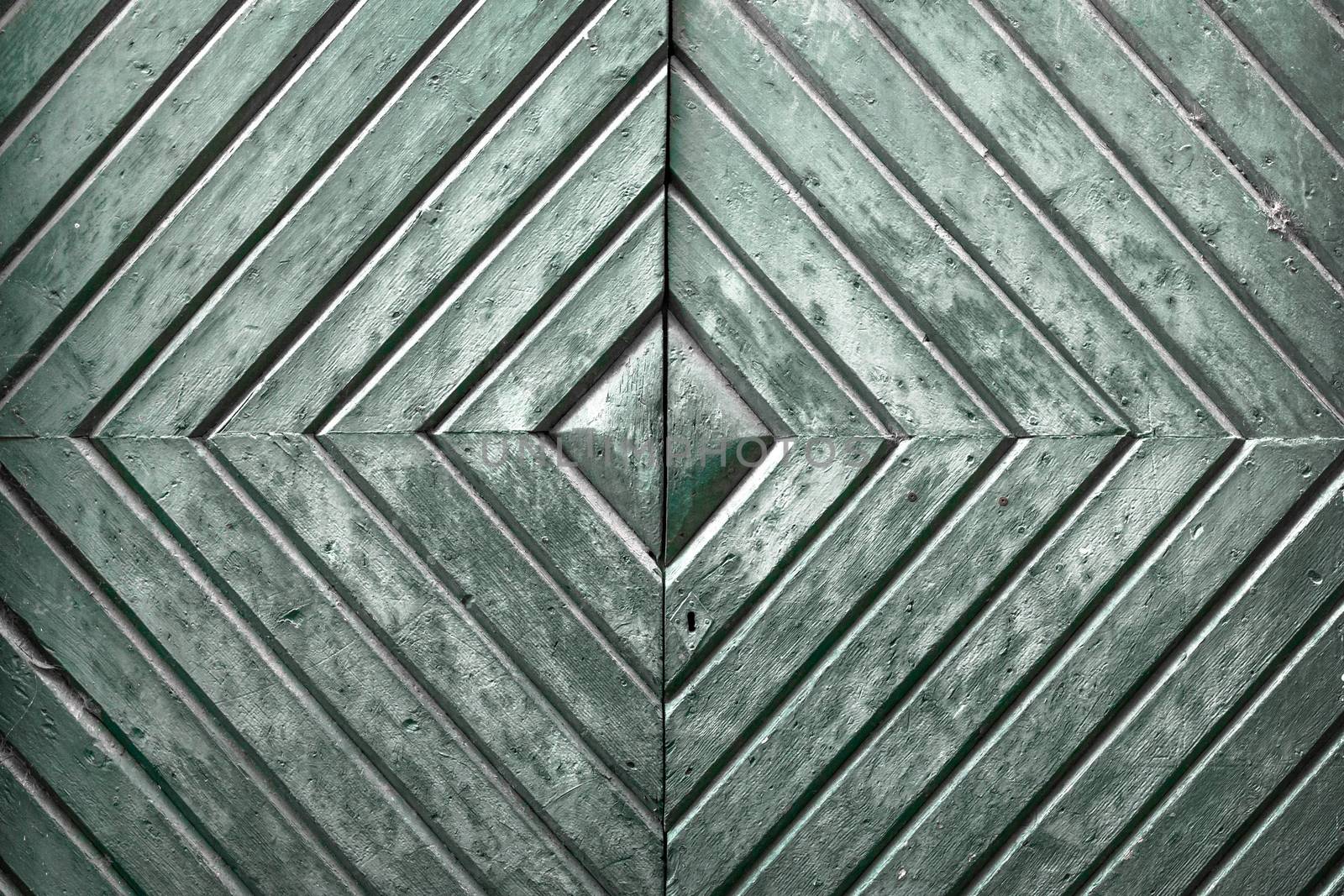 Details of an old wooden door with diamond pattern.