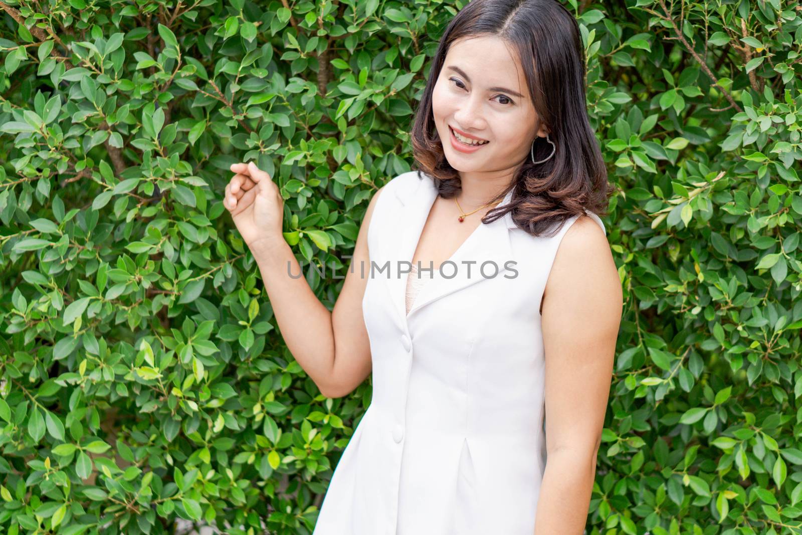 Woman happy feeling with green nature background