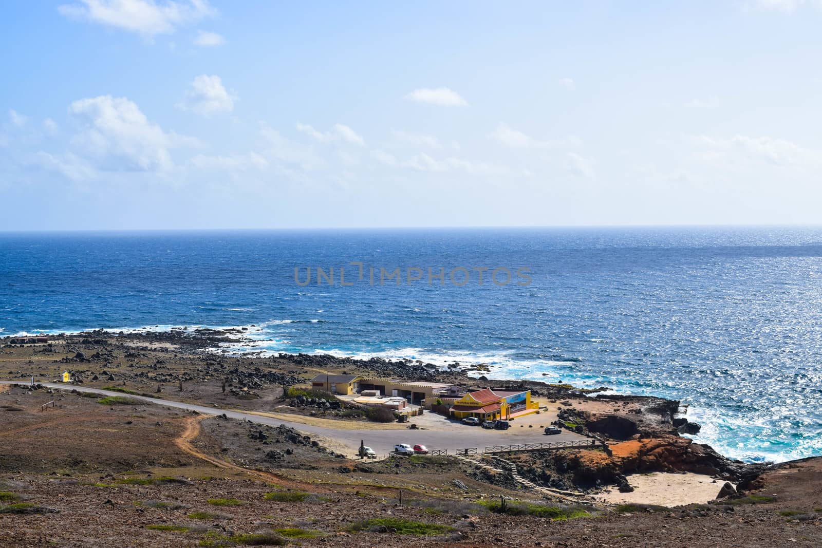 Arikok Natural Park on the island of Aruba in the Caribbean Sea with deserts and ocean waves on the rocky coast