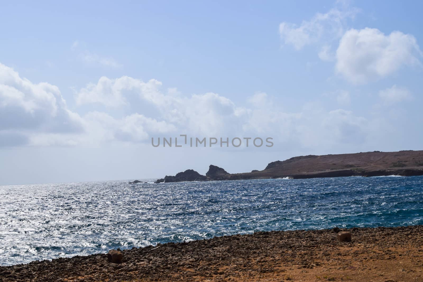 Arikok Natural Park on the island of Aruba in the Caribbean Sea with deserts and ocean waves on the rocky coast